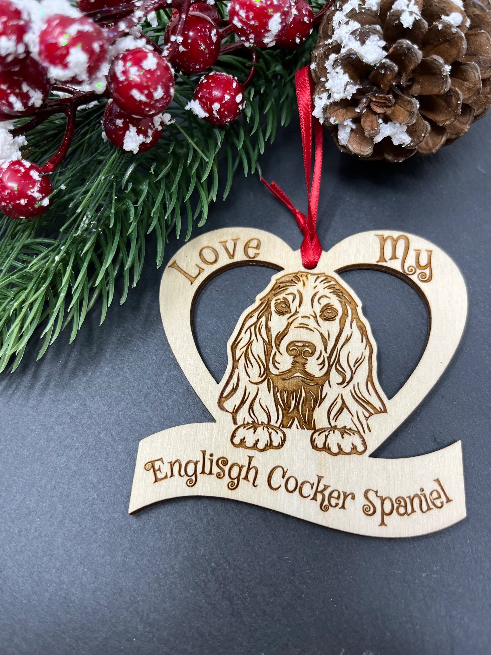 Beautiful laser engraved wooden ornament featuring an English Cocker Spaniel, perfect for Christmas or as a collectible.