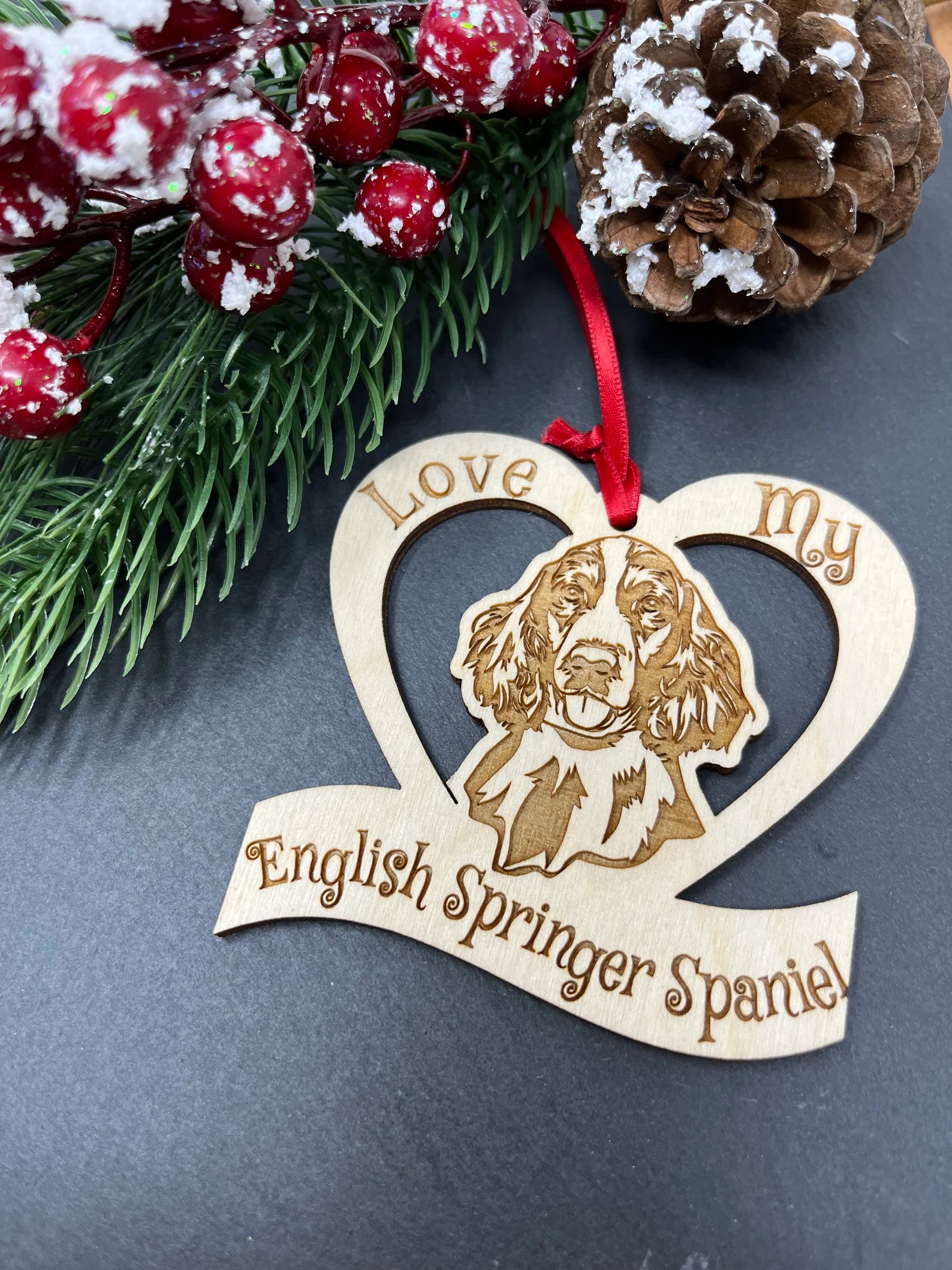 Laser engraved wooden ornament featuring an English Springer Spaniel, perfect for Christmas decoration.