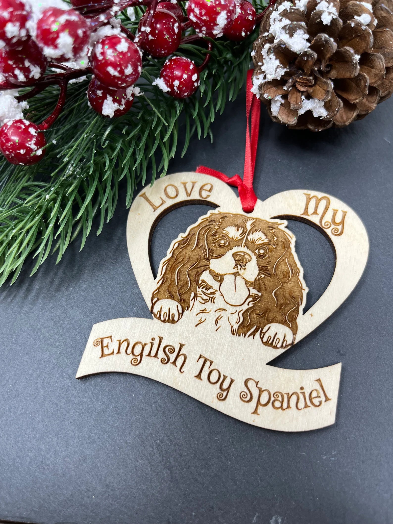 Laser engraved wooden ornament featuring an English Toy Spaniel, perfect for Christmas decoration.