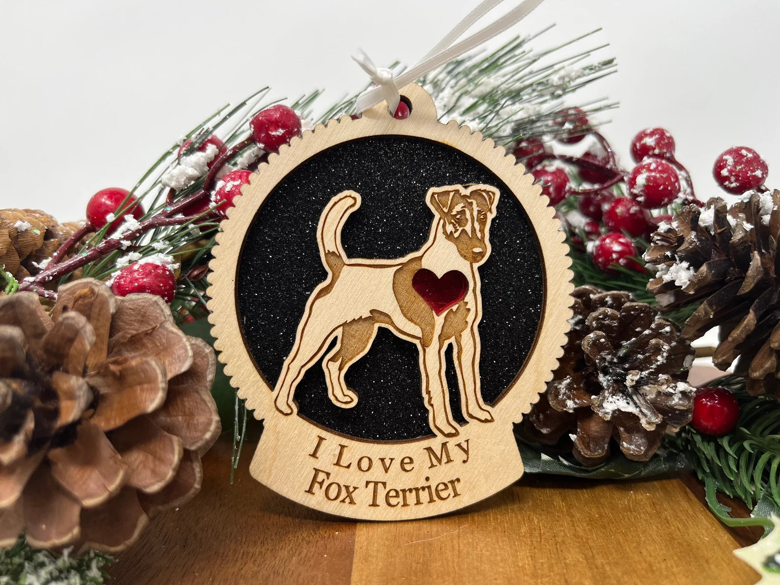 A beautifully crafted wooden ornament featuring a silhouette of a Fox Terrier, perfect for Christmas decorations.