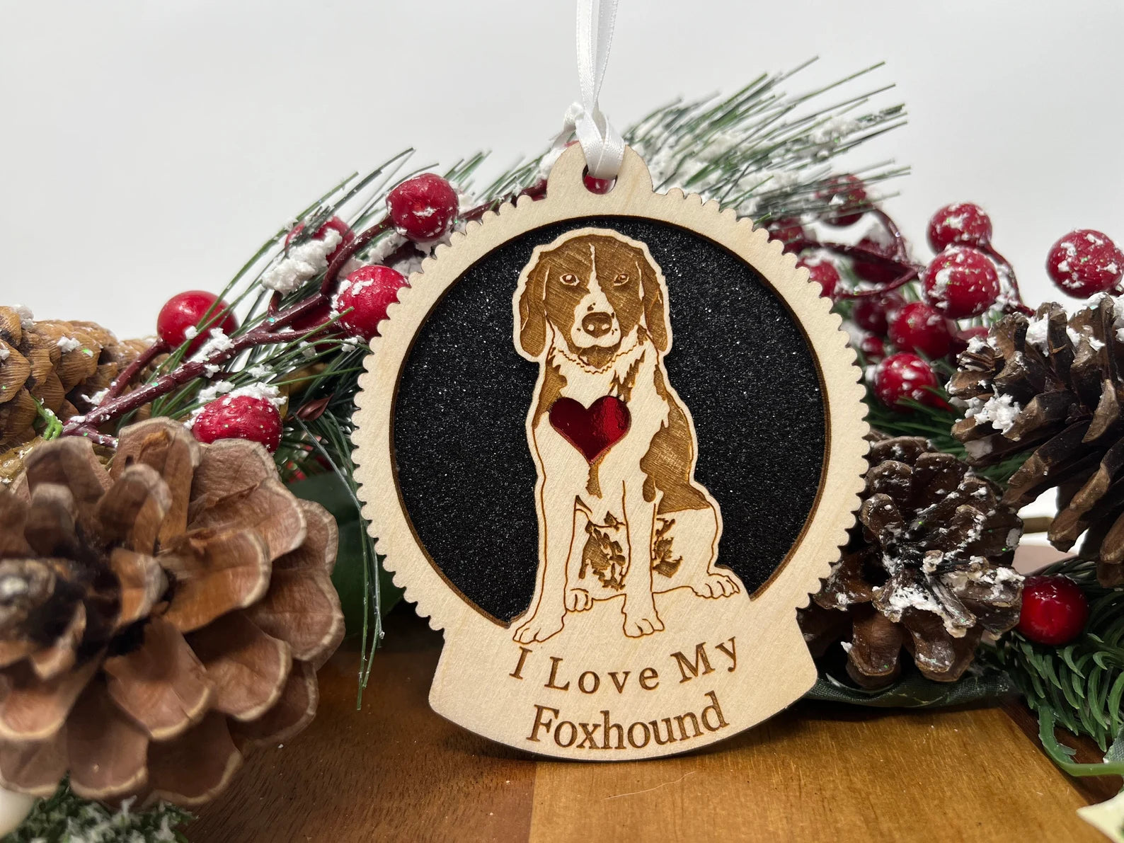 A beautifully crafted laser-cut wooden ornament featuring a Foxhound silhouette, perfect for Christmas decor.