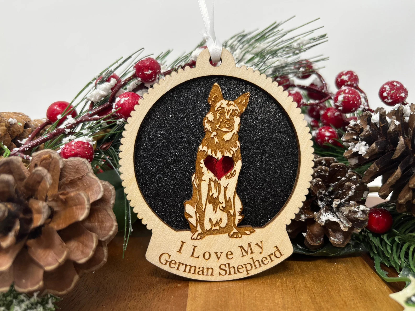 Laser cut wooden ornament featuring a German Shepherd silhouette, perfect for Christmas decoration.