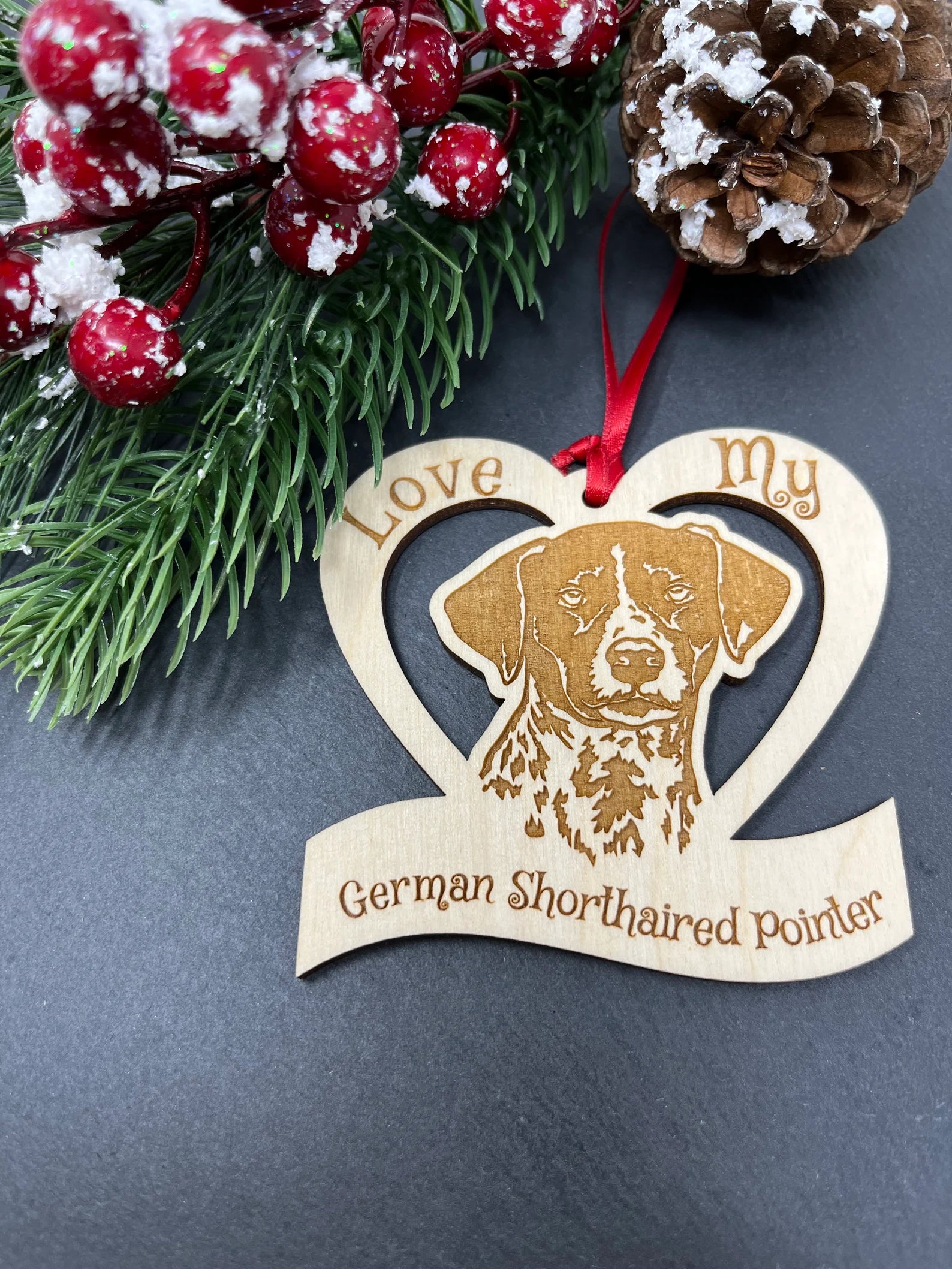 Laser engraved wooden ornament featuring a German Shorthaired Pointer, perfect for Christmas or as a collectible.