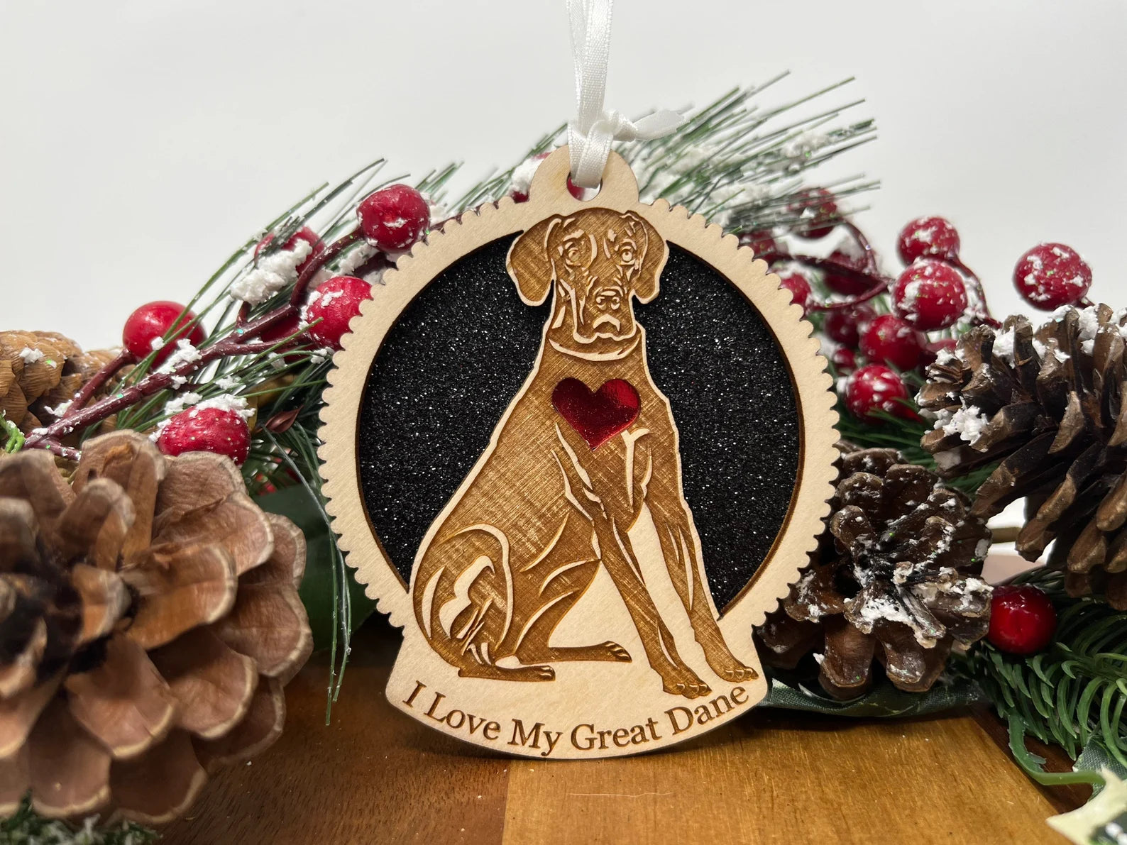 Beautiful laser-cut wooden ornament featuring a Great Dane silhouette, perfect for holiday decor.