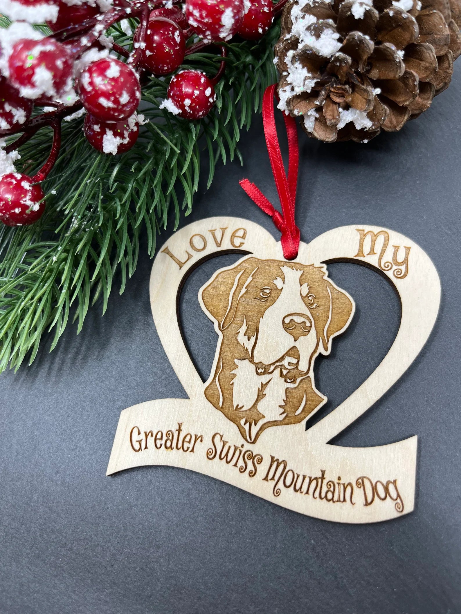 Laser engraved wooden ornament featuring a Greater Swiss Mountain Dog, perfect for Christmas decoration.