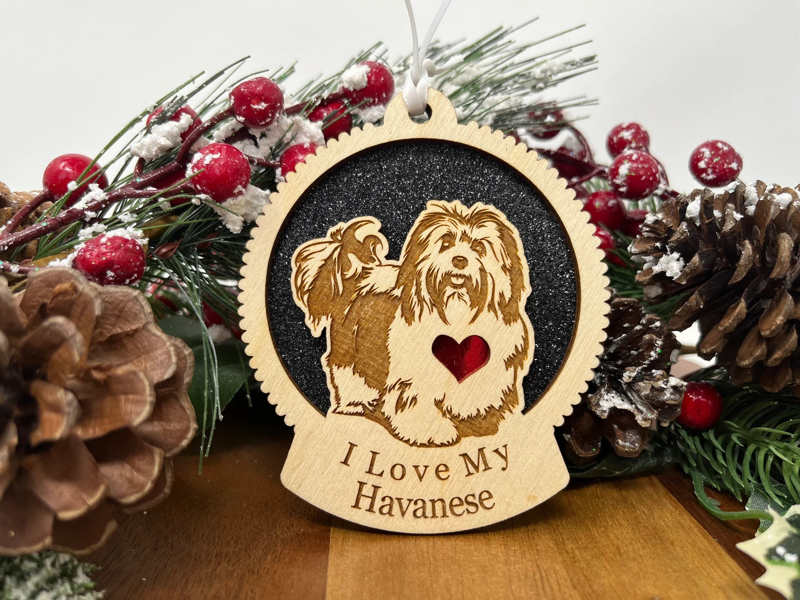 A beautifully crafted laser-cut wooden ornament featuring a Havanese dog silhouette, perfect for Christmas decoration.