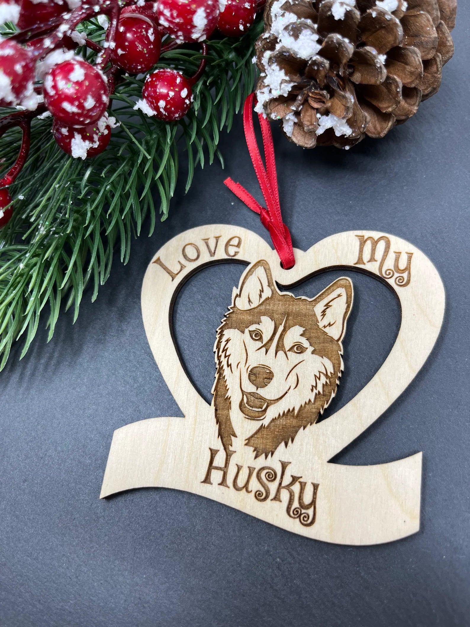 Beautiful laser engraved wooden ornament featuring a husky design, perfect for Christmas decoration.