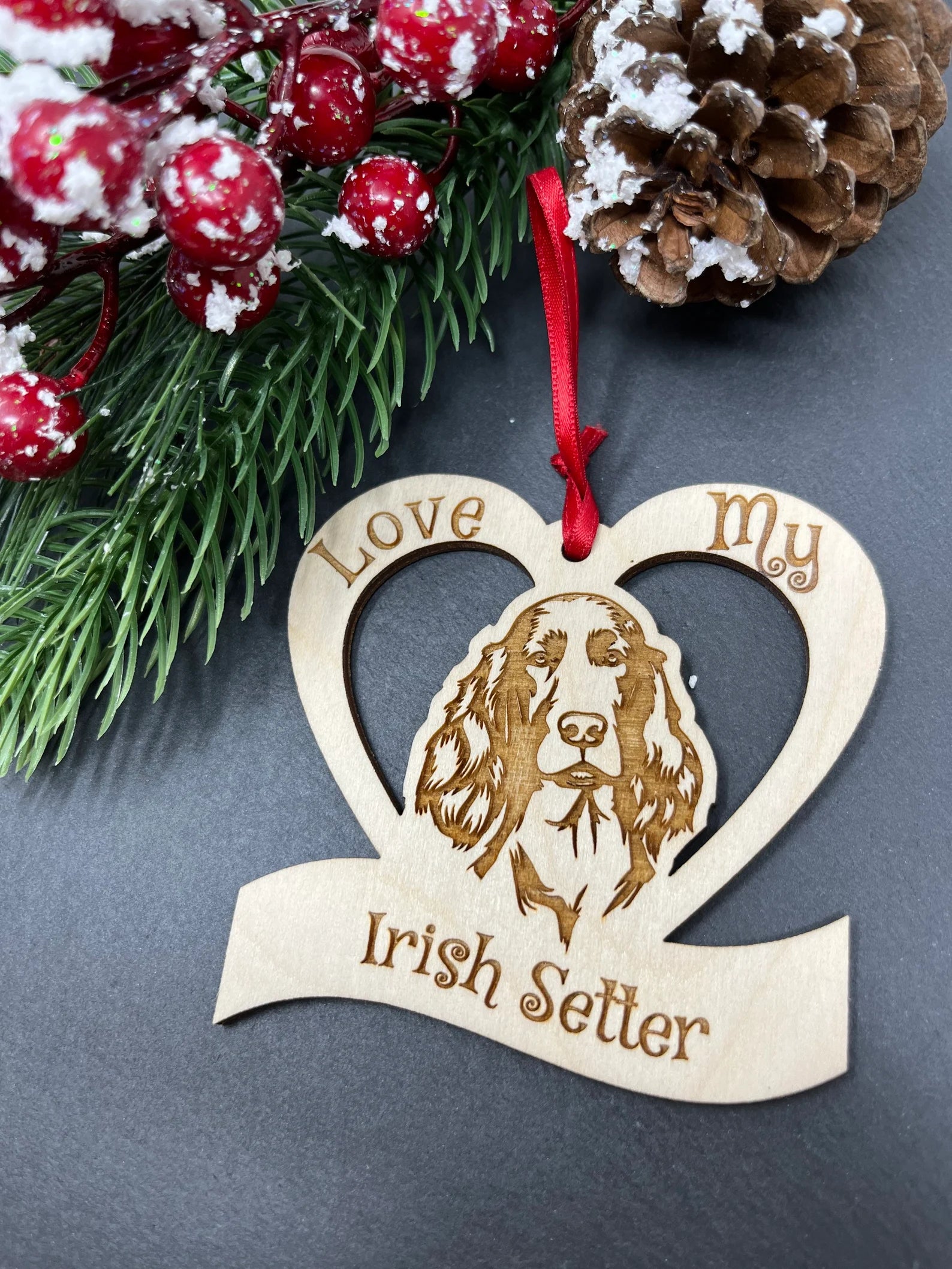 Laser engraved wooden ornament featuring an Irish Setter, perfect for Christmas decoration.