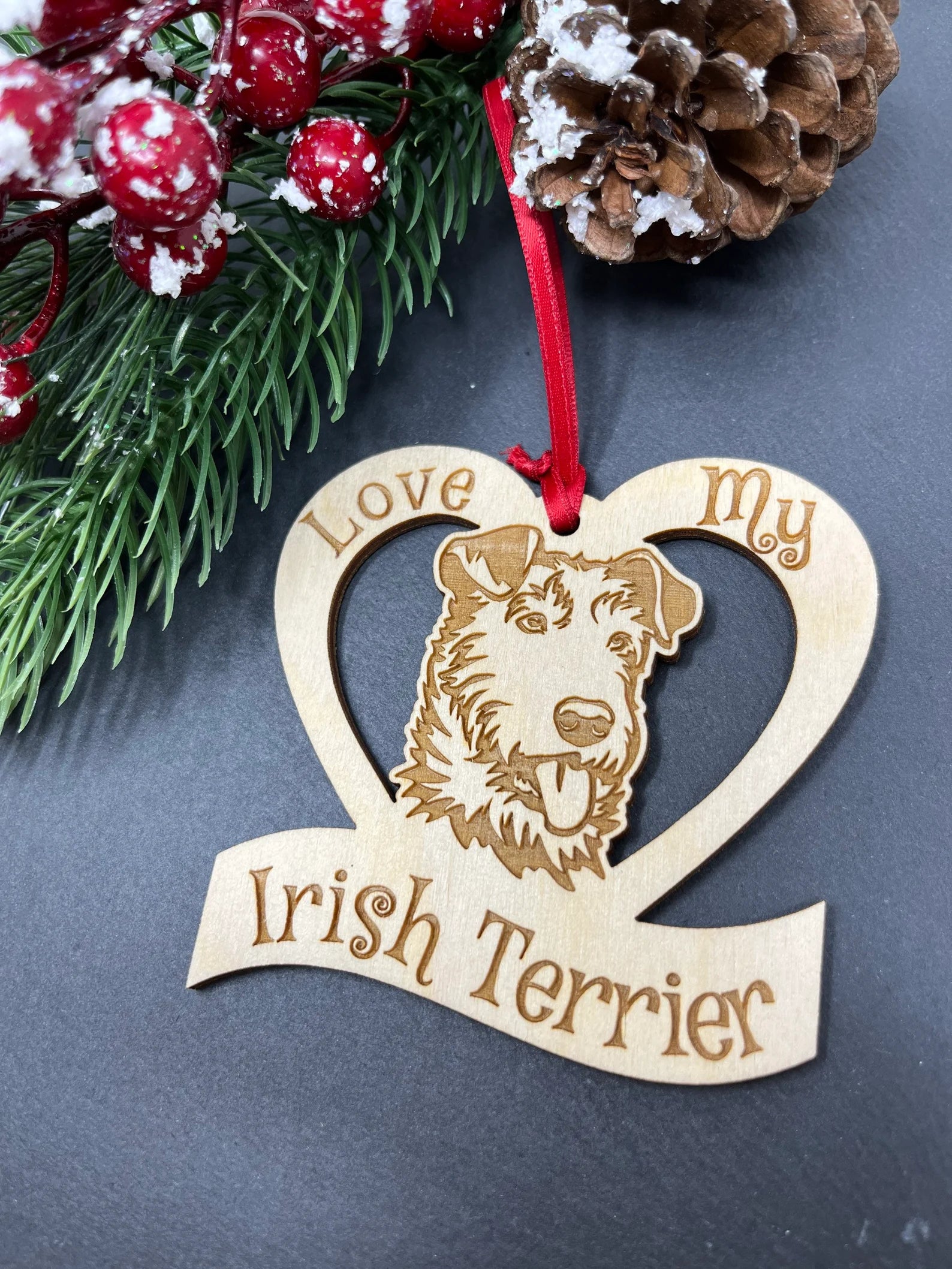 Laser engraved wooden ornament featuring an Irish Terrier, perfect for Christmas decoration.