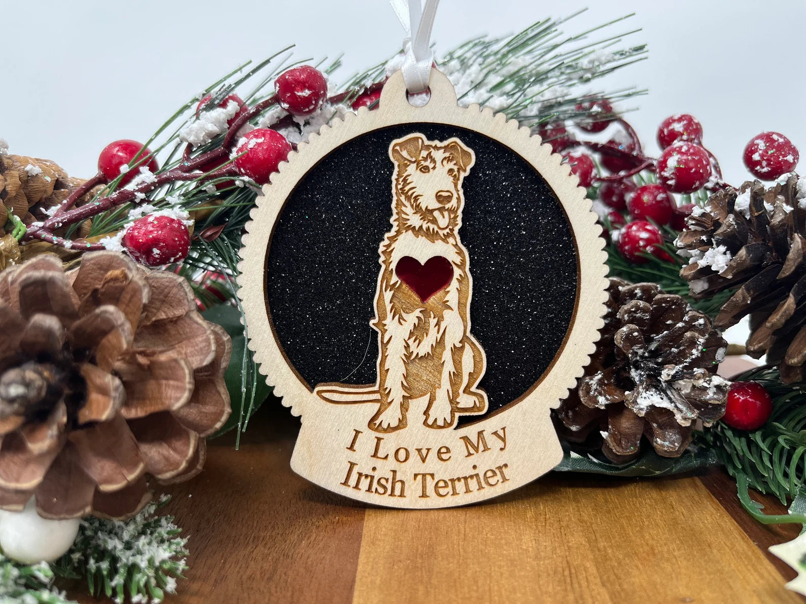 A beautifully crafted laser-cut wooden ornament featuring an Irish Terrier silhouette, perfect for holiday decor.