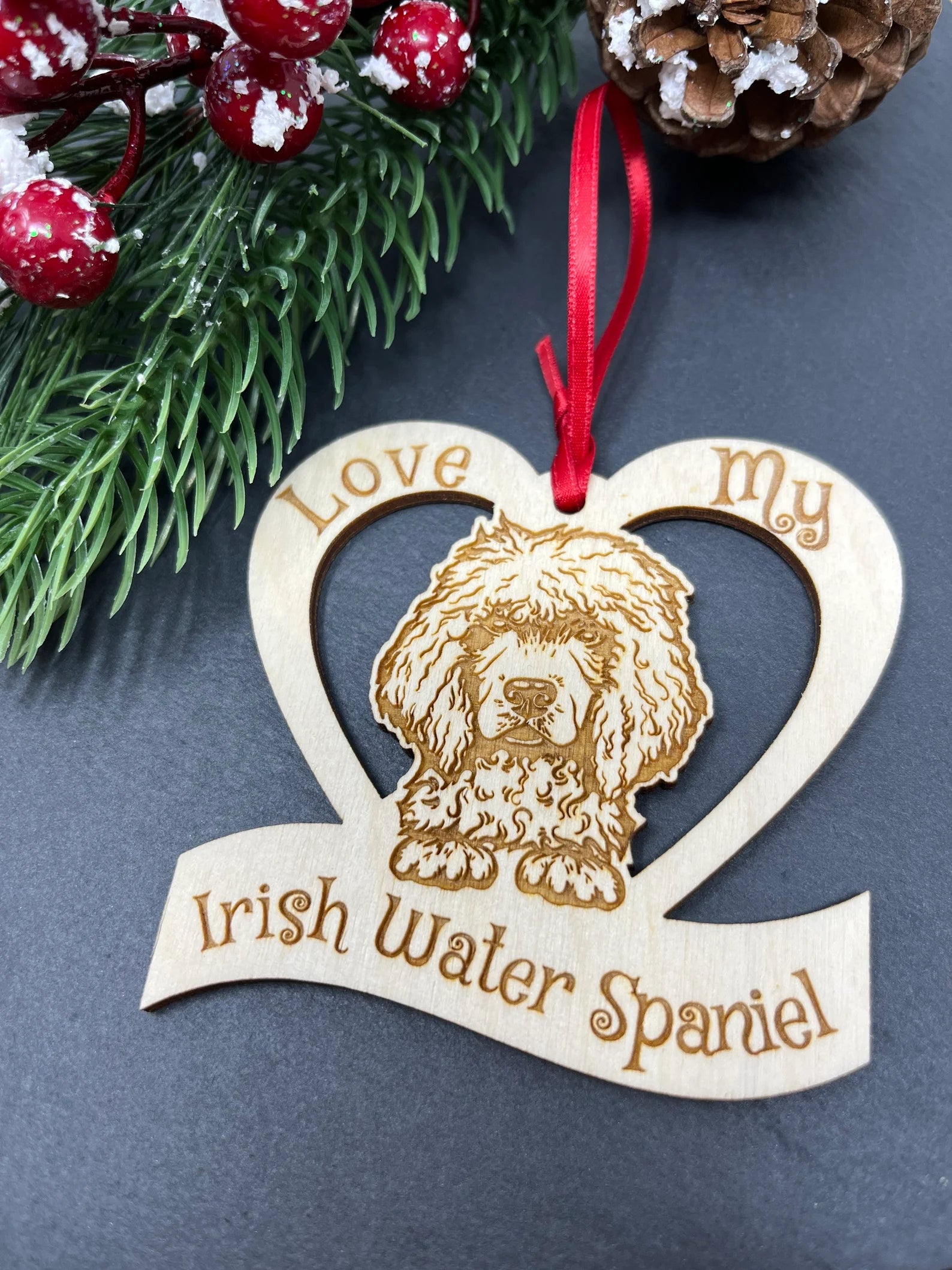 Laser engraved wooden ornament featuring an Irish Water Spaniel, perfect for Christmas decoration.