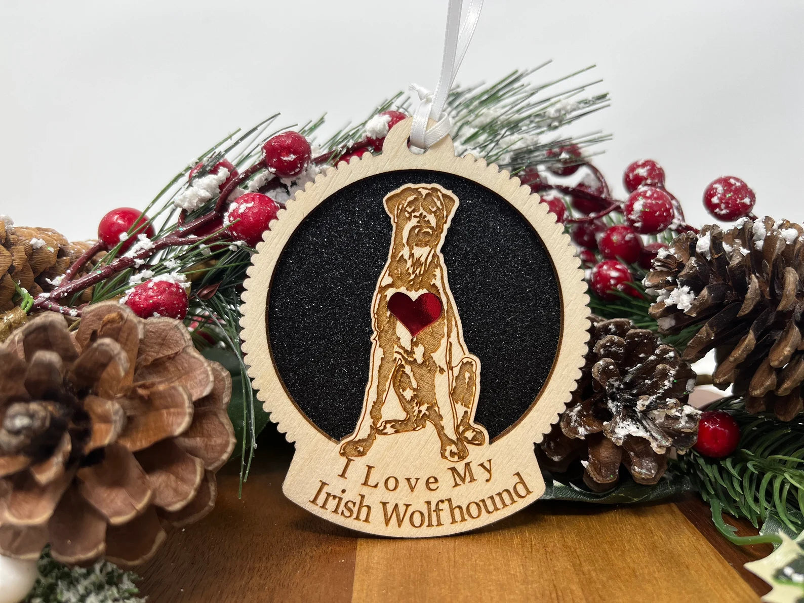 A beautifully crafted wooden ornament featuring the silhouette of an Irish Wolfhound, perfect for Christmas decorations.