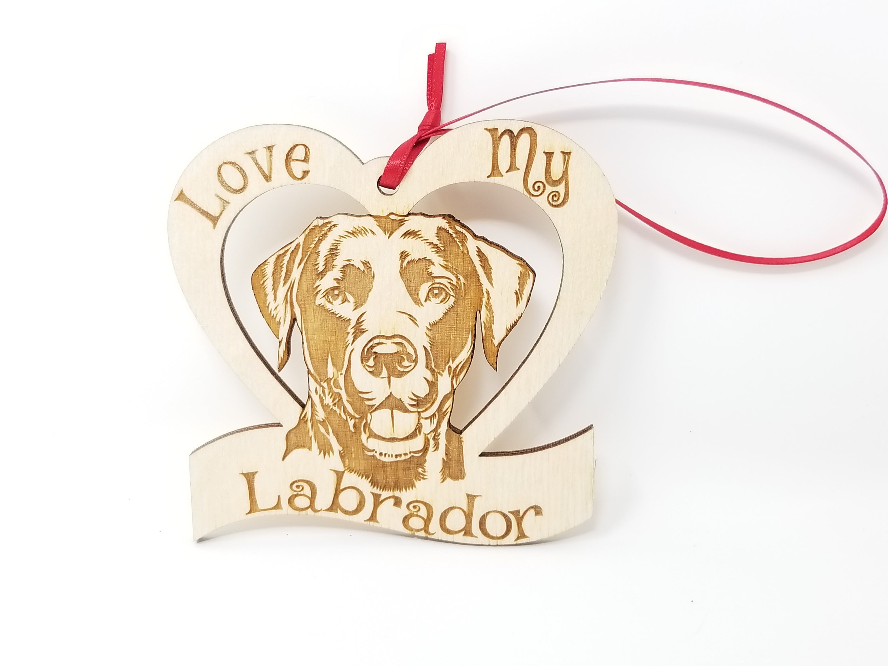 Laser engraved wooden ornament featuring a Labrador design, perfect for Christmas decoration.