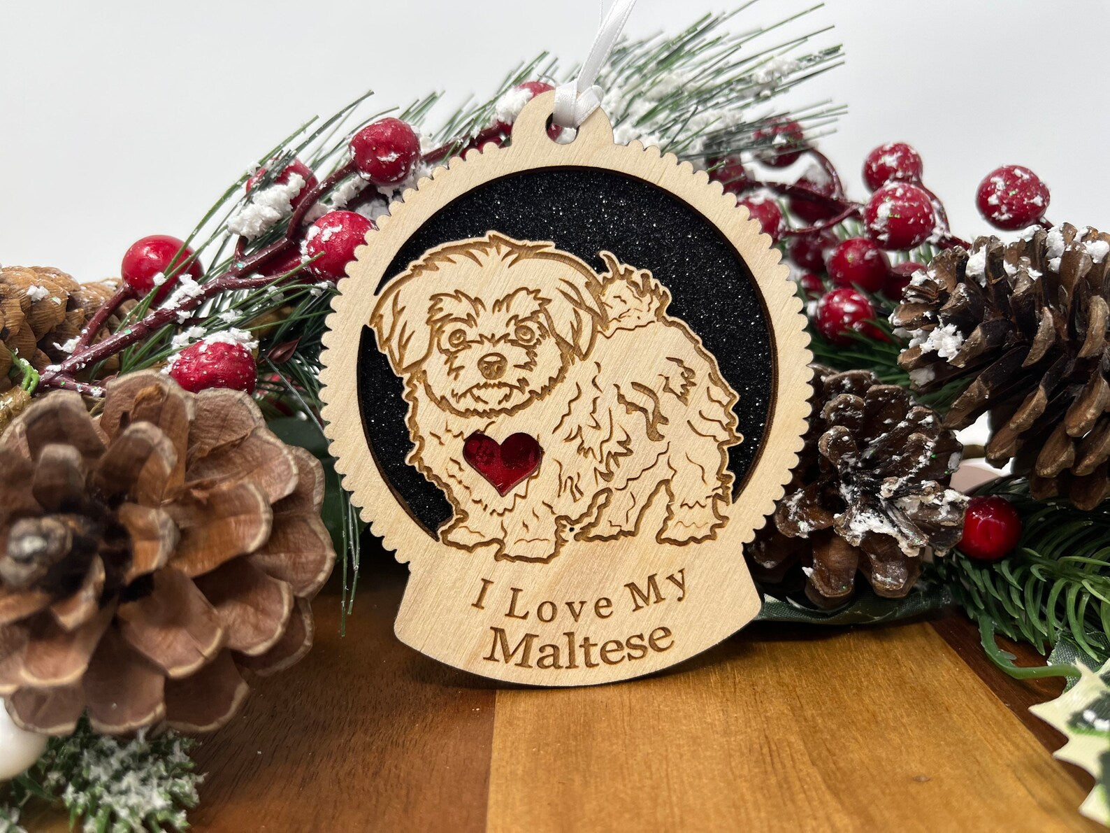 A beautifully crafted Love My Maltese ornament made from laser-cut Baltic Birch wood, featuring a silhouette of a Maltese dog, ready to hang with a ribbon.