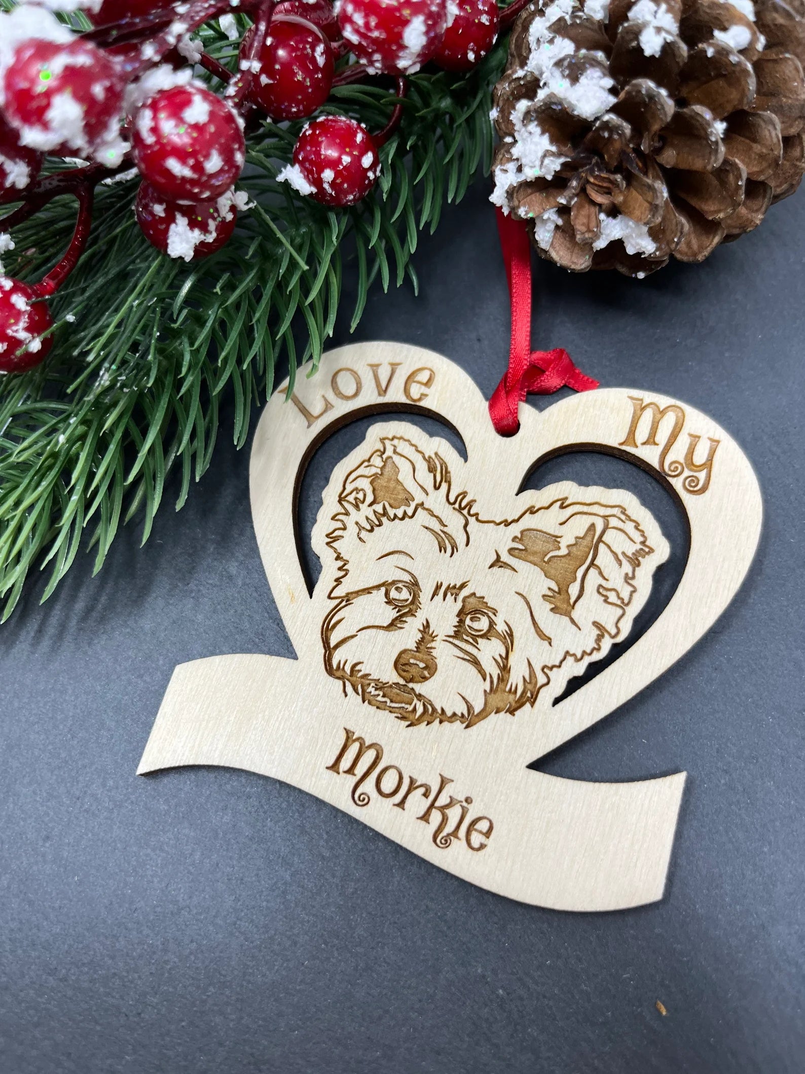 Love My Morkie ornament made of laser engraved Baltic Birch wood, featuring a unique design and attached ribbon for hanging.