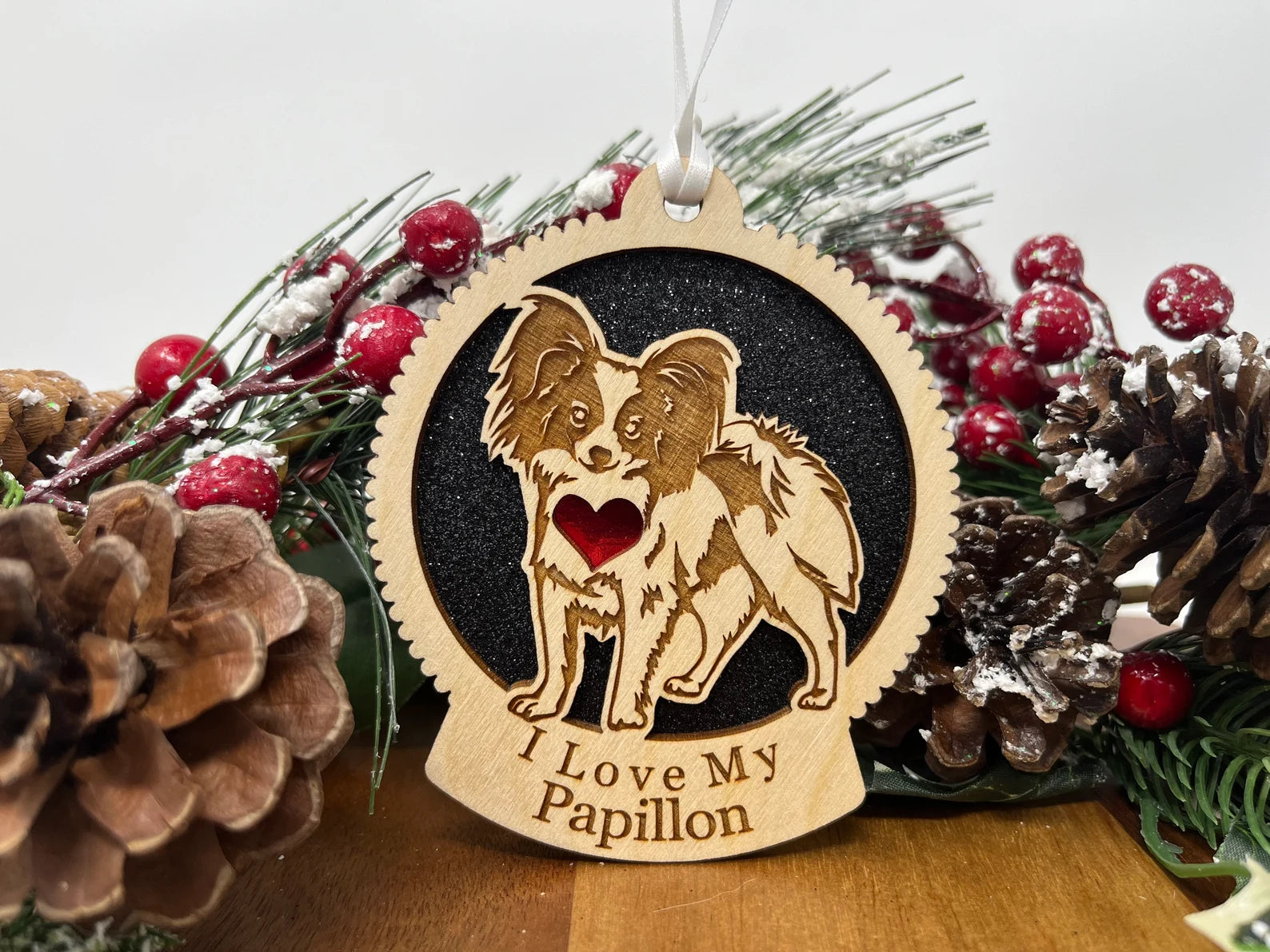 Love My Papillon Christmas ornament featuring a laser-cut silhouette of a Papillon dog made from Baltic Birch wood.