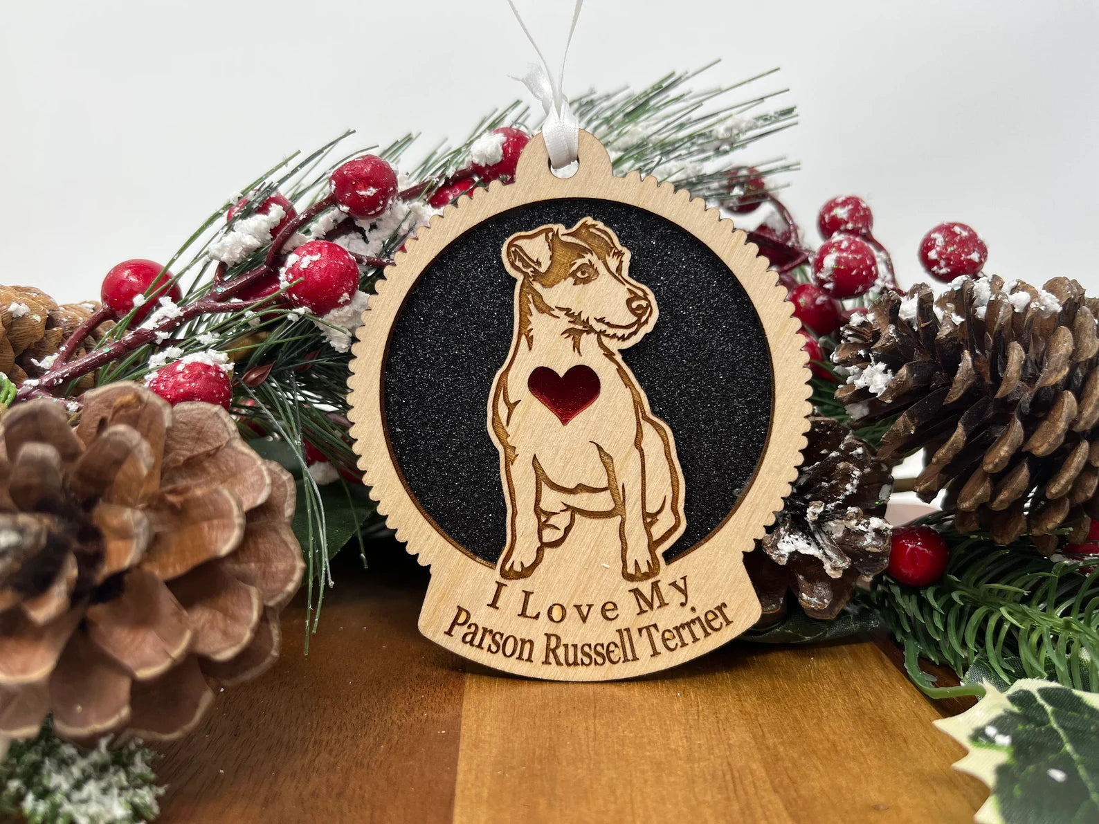 Laser cut wooden ornament featuring a Parson Russell Terrier silhouette, perfect for Christmas or home decor.