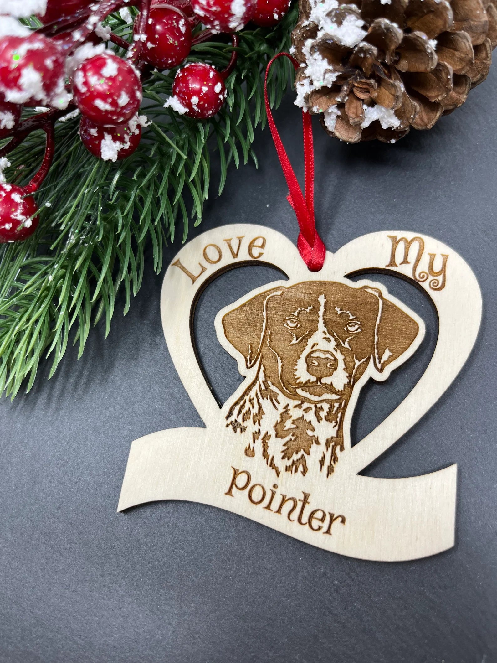 Love My Pointer ornament made of laser engraved Baltic Birch wood, featuring a unique design celebrating dogs, ready to hang with a ribbon.