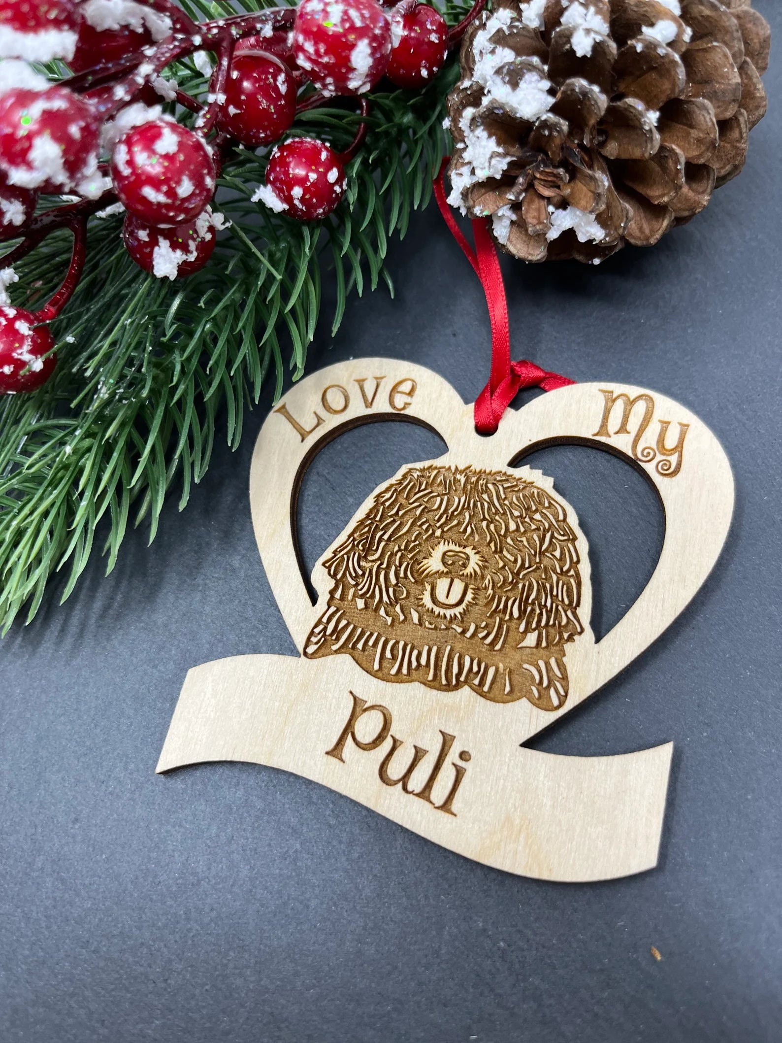 Love My Puli ornament made of laser engraved Baltic Birch wood, featuring a unique design celebrating dogs, ready to hang with a ribbon.