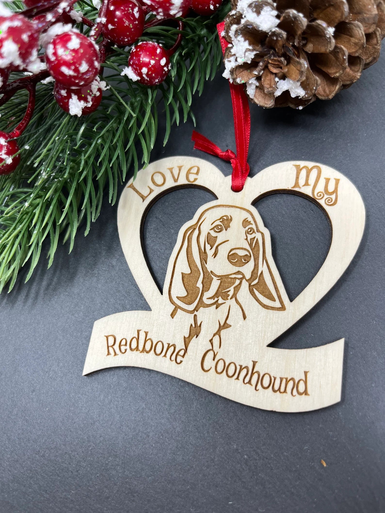 Laser engraved wooden ornament featuring a Redbone Coonhound, perfect for Christmas decoration.