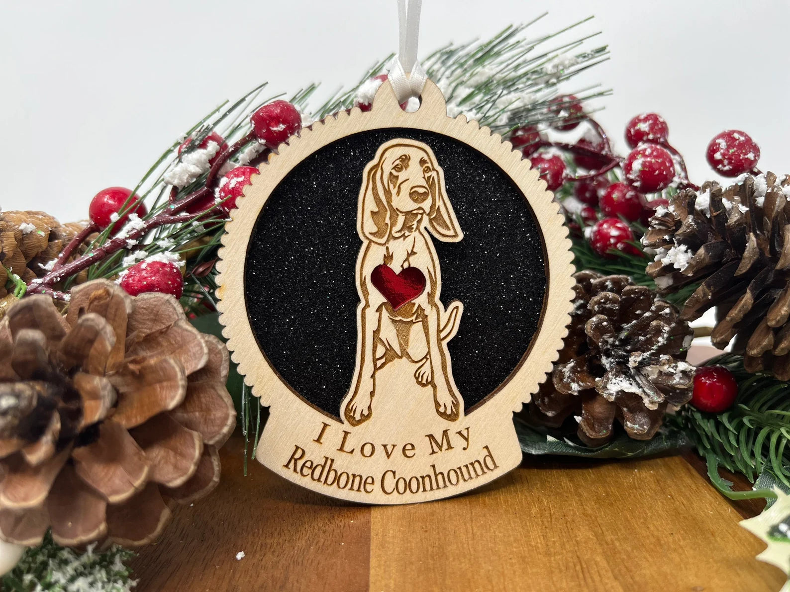 Laser cut wooden ornament featuring a Redbone Coonhound silhouette, perfect for Christmas decoration.