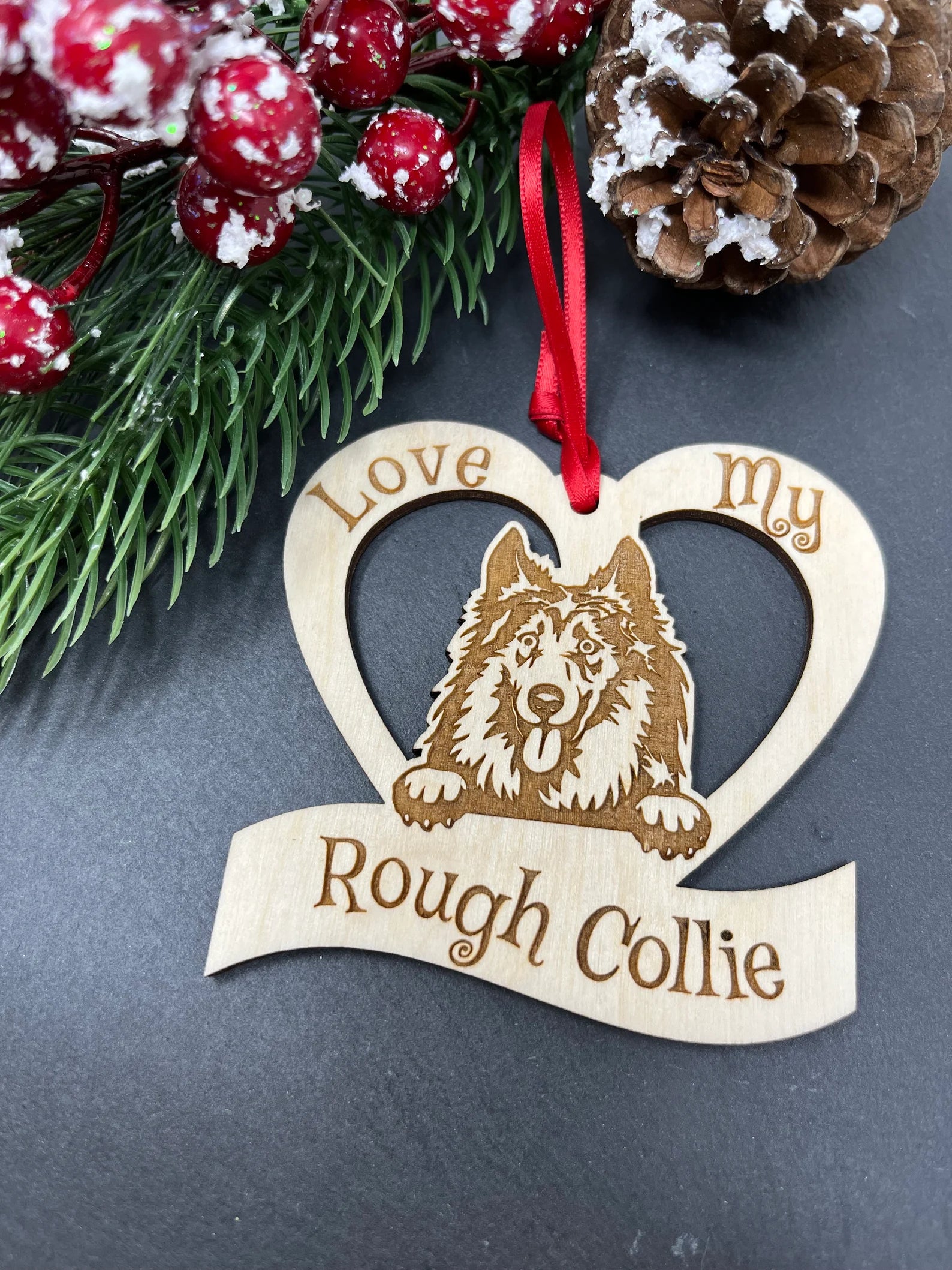 Laser engraved wooden ornament featuring a Rough Collie design, perfect for Christmas trees or wall hanging.