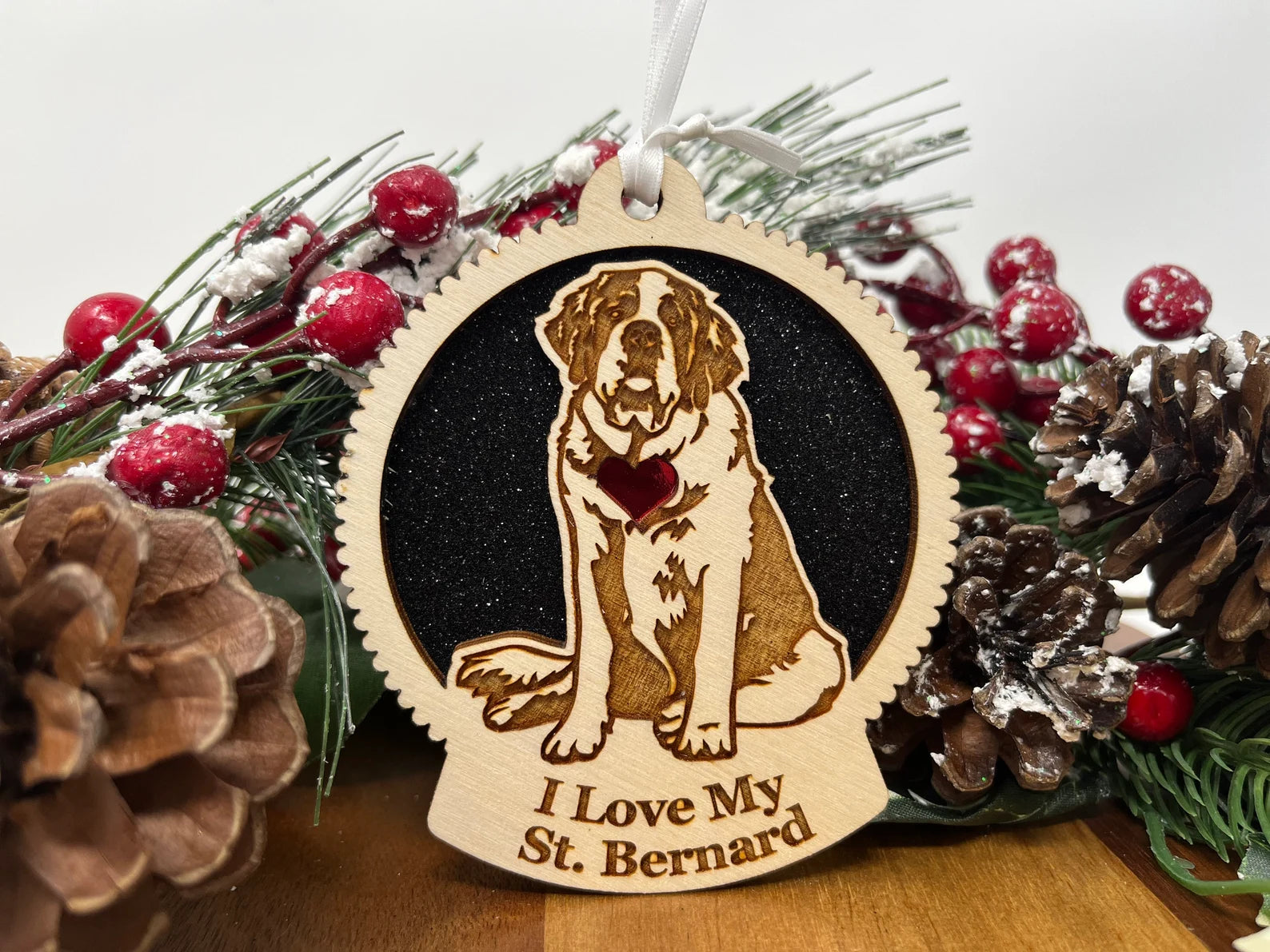 A beautifully crafted wooden ornament featuring a silhouette of a Saint Bernard, perfect for Christmas decoration.