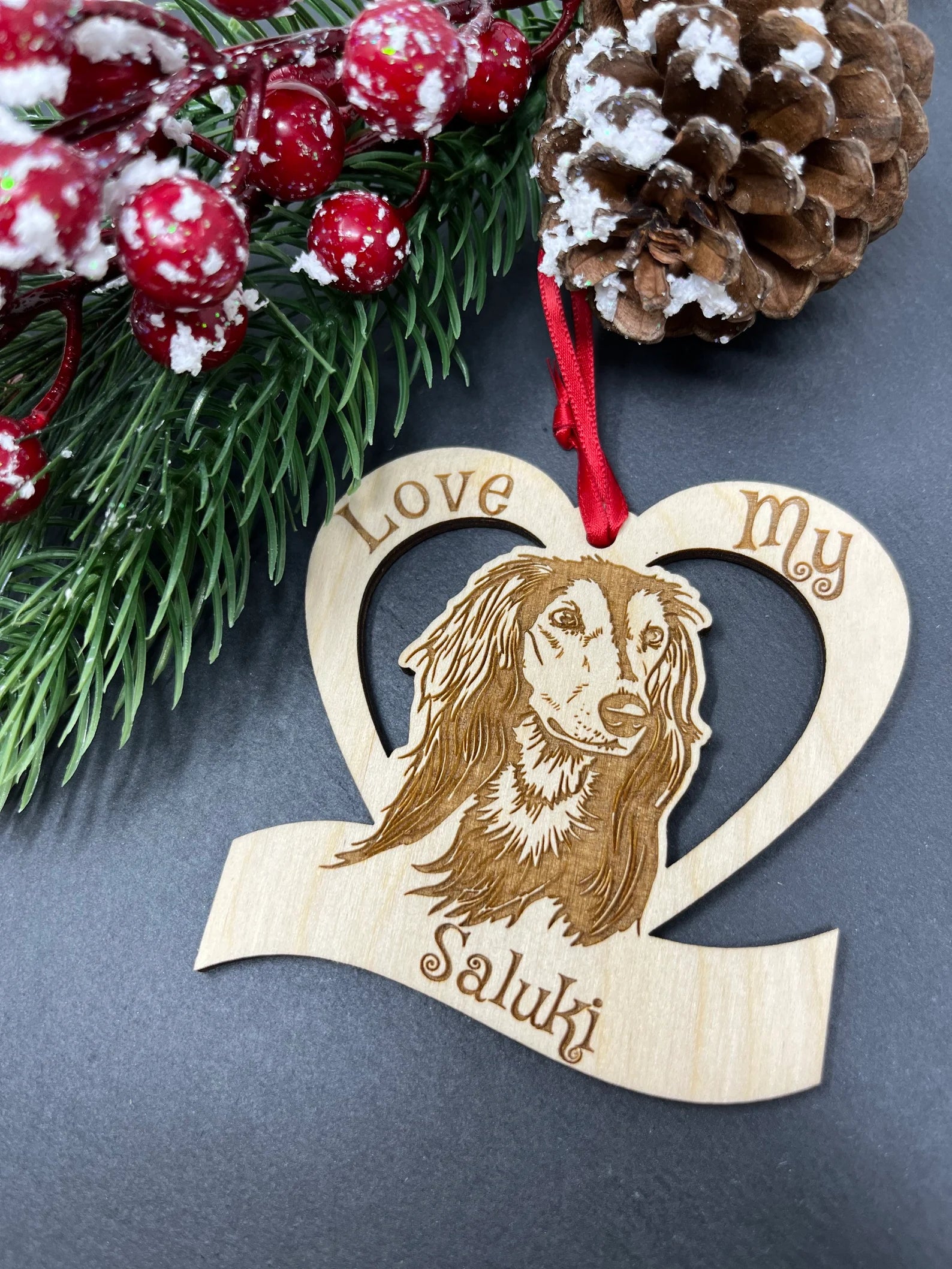 Love My Saluki ornament made of laser engraved Baltic Birch wood, featuring a unique design and attached ribbon for hanging.