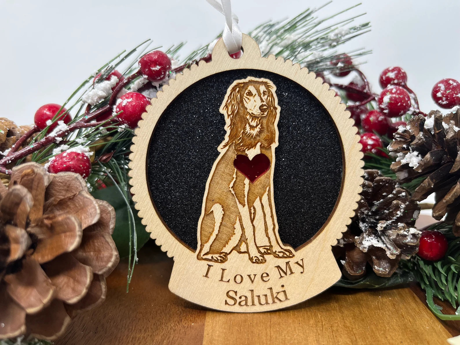 A beautifully crafted wooden ornament featuring a Saluki silhouette, perfect for Christmas decoration.