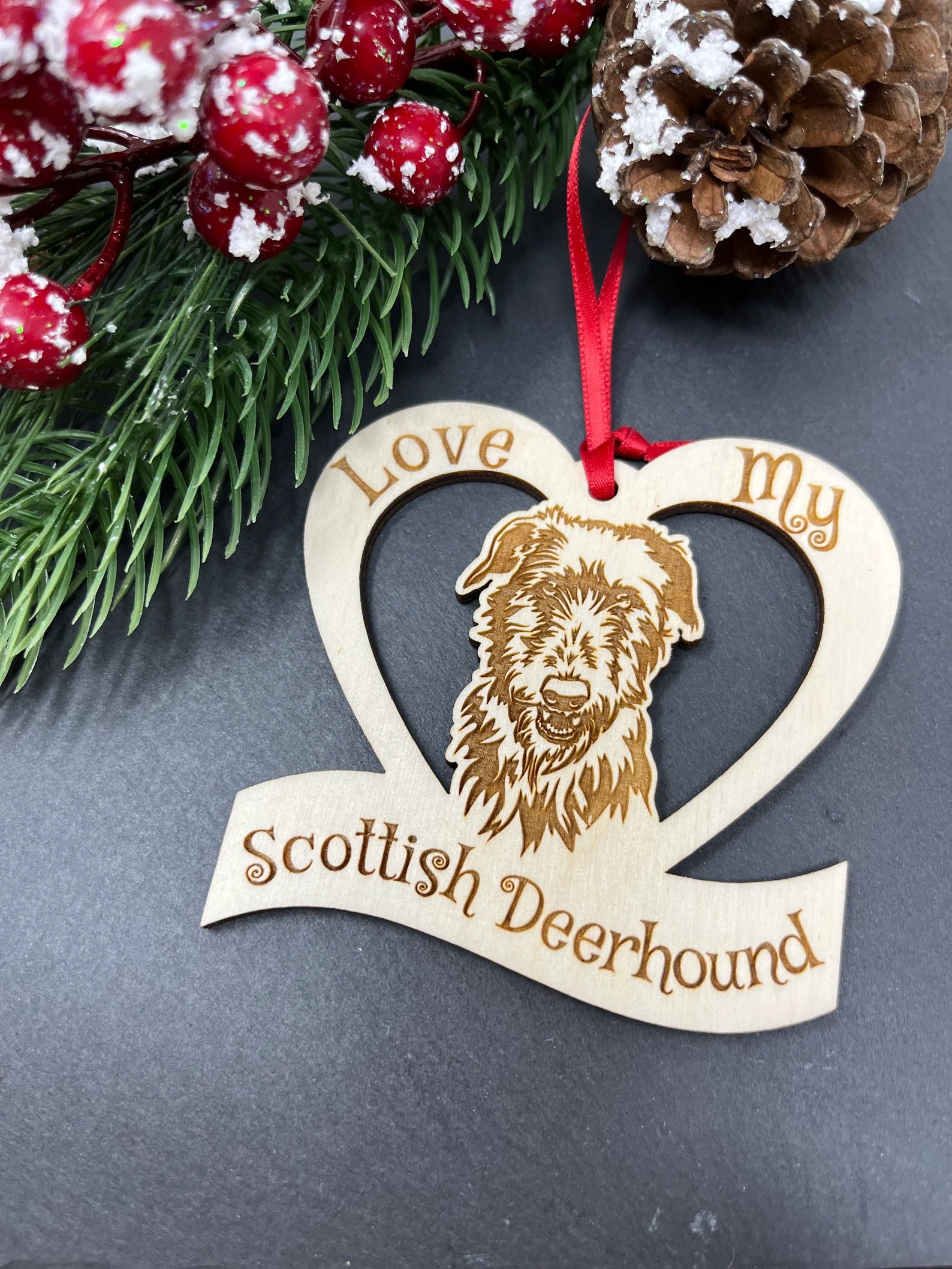 Beautiful laser engraved wooden ornament featuring a Scottish Deerhound, perfect for Christmas decoration.