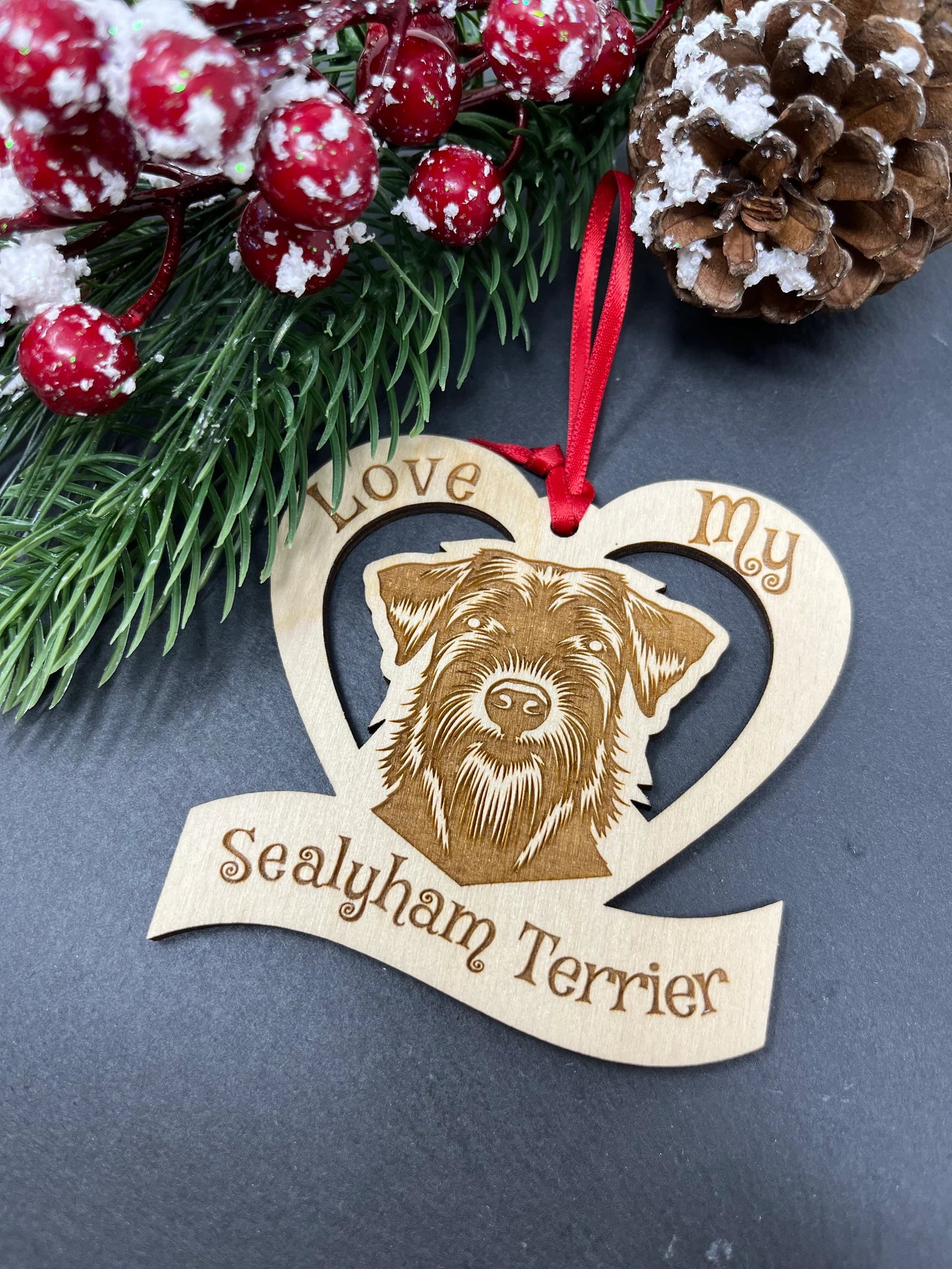 Laser engraved wooden ornament featuring a Sealyham Terrier, perfect for Christmas decoration.