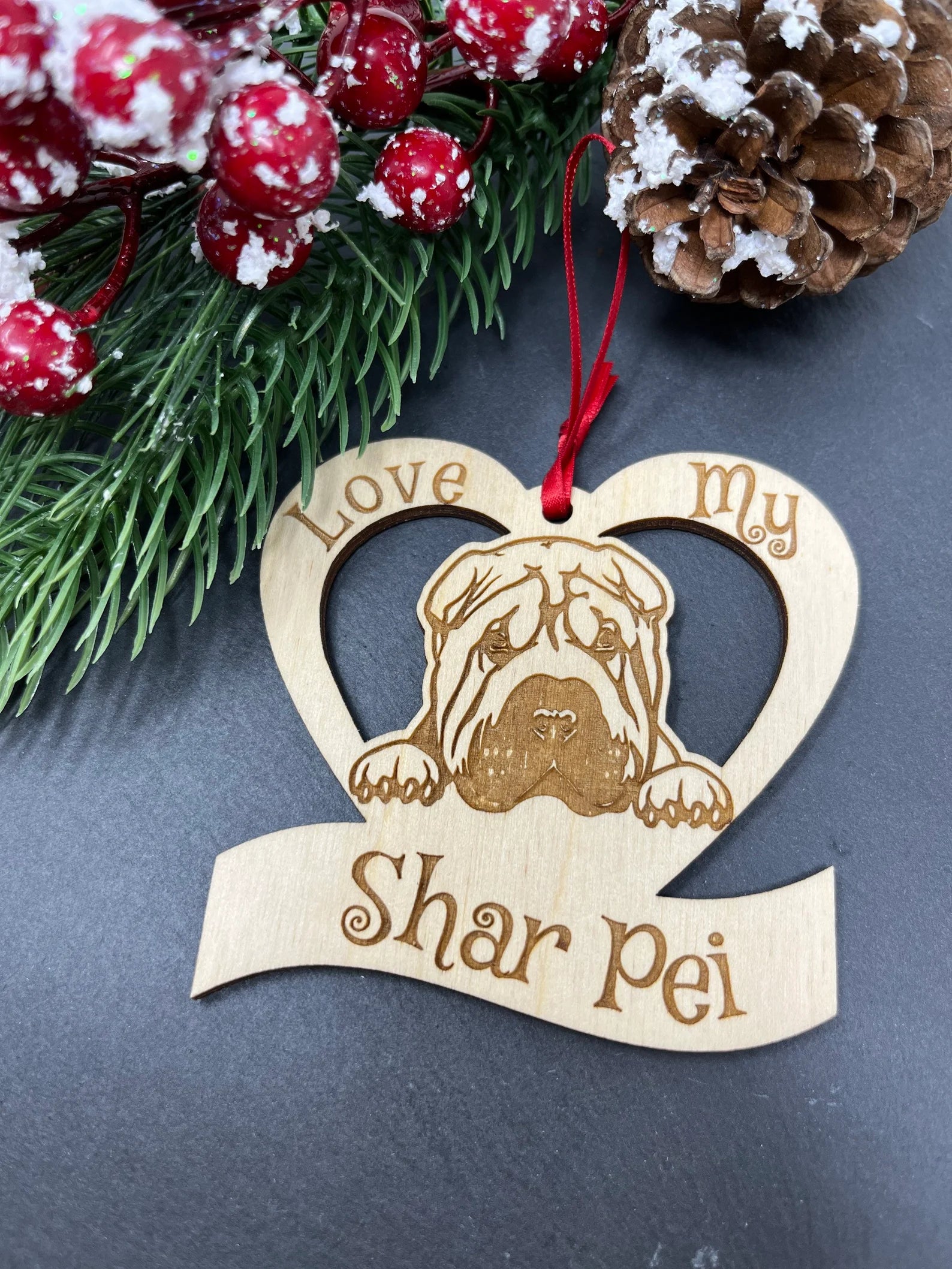 Laser engraved wooden ornament featuring a Shar Pei design, perfect for Christmas decoration.