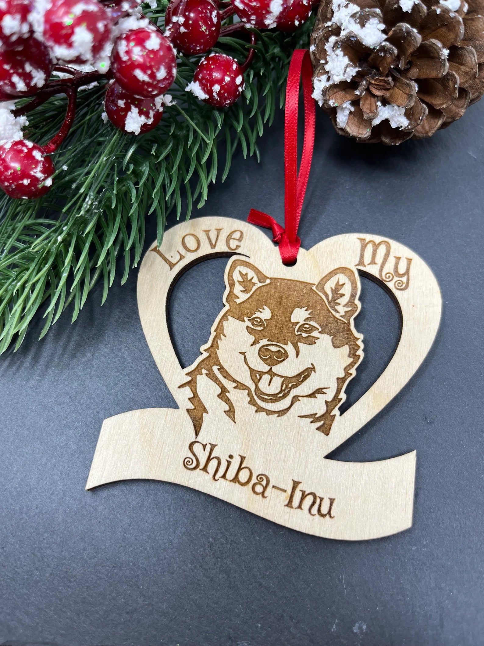 Laser engraved wooden ornament featuring a Shiba Inu design, perfect for Christmas decoration.