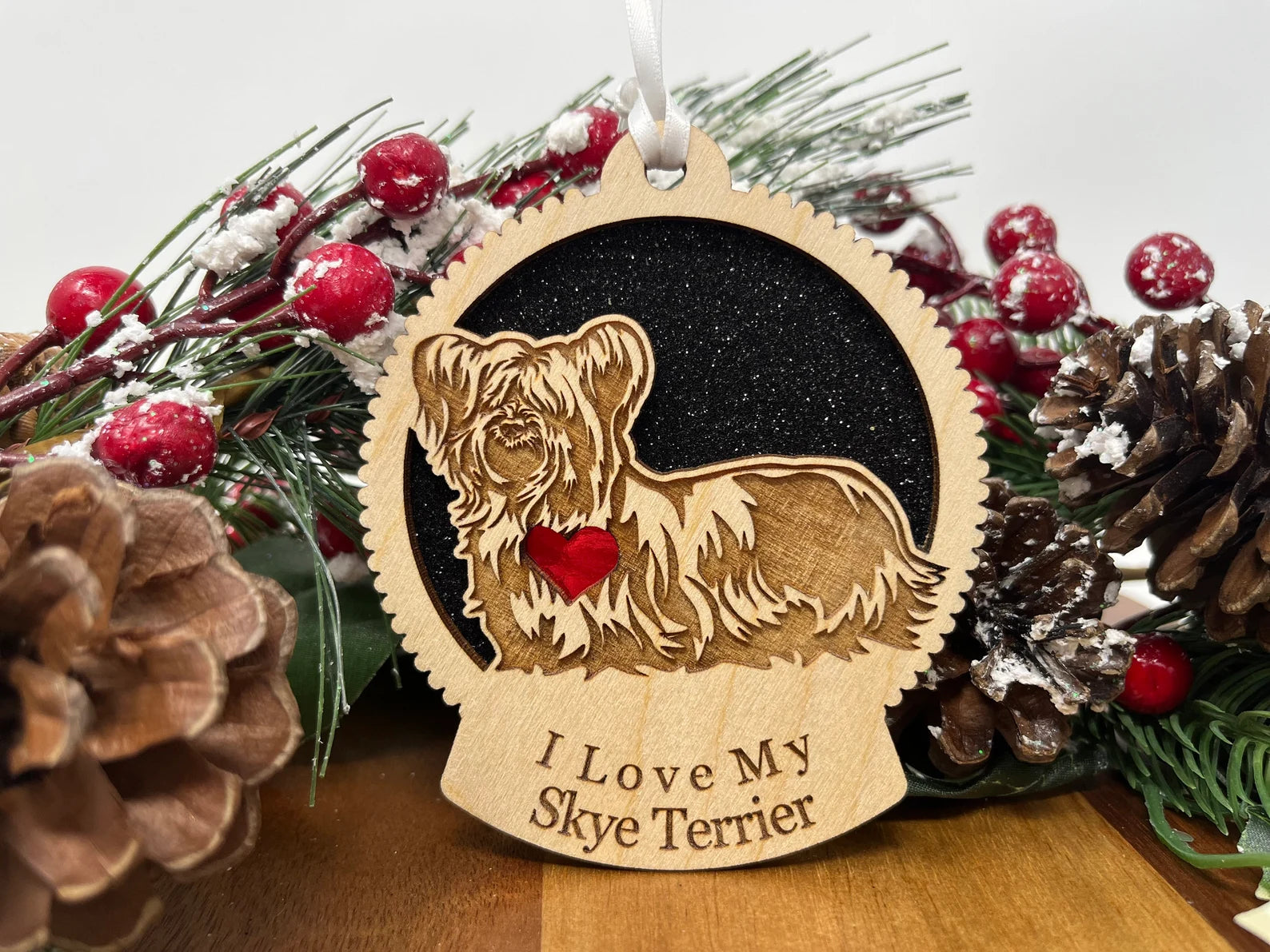 A beautifully crafted wooden ornament featuring a silhouette of a Skye Terrier, perfect for Christmas decoration.