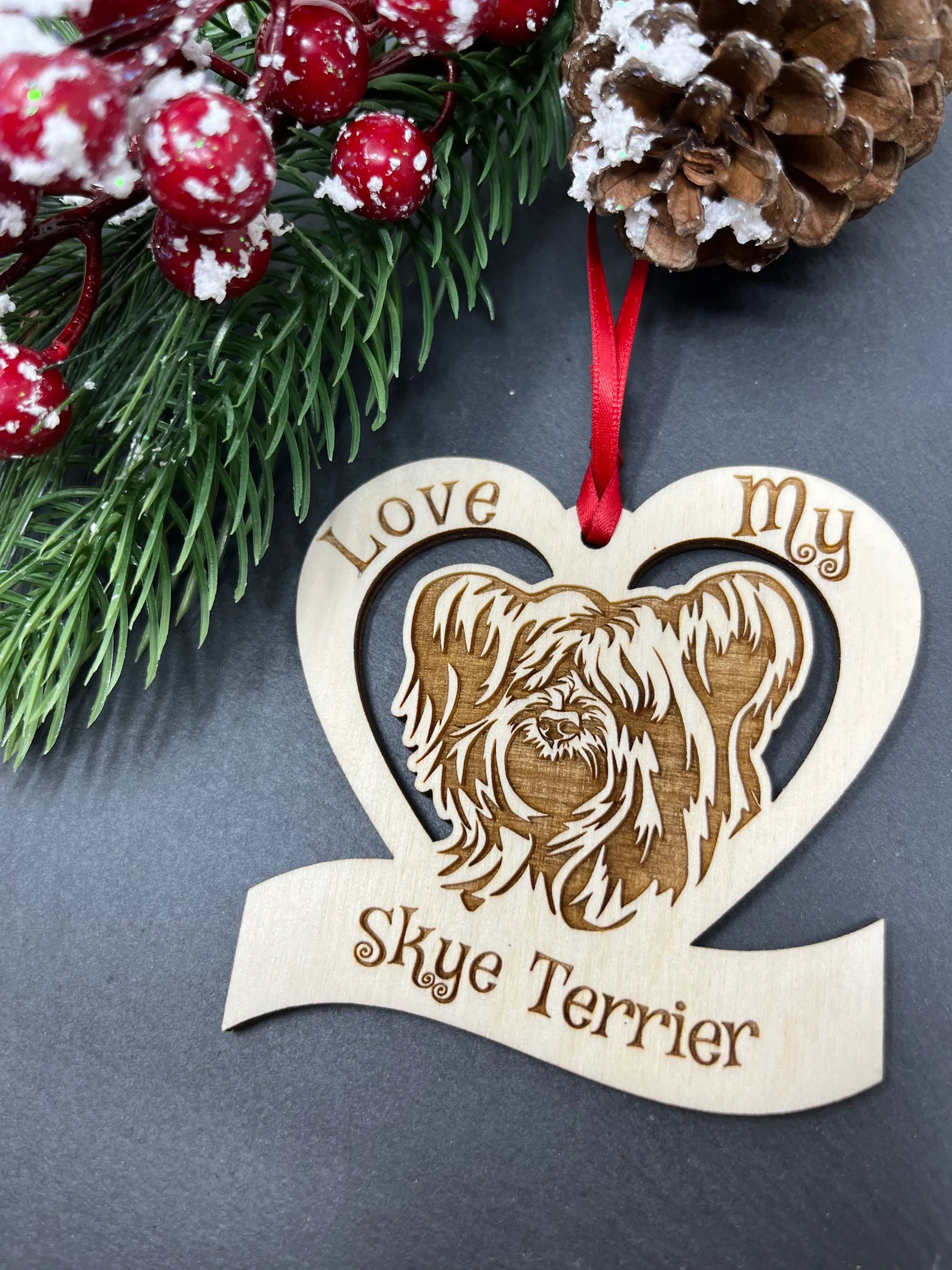 Love My Skye Terrier ornament made of laser engraved Baltic Birch wood, featuring a unique design and attached ribbon for hanging.