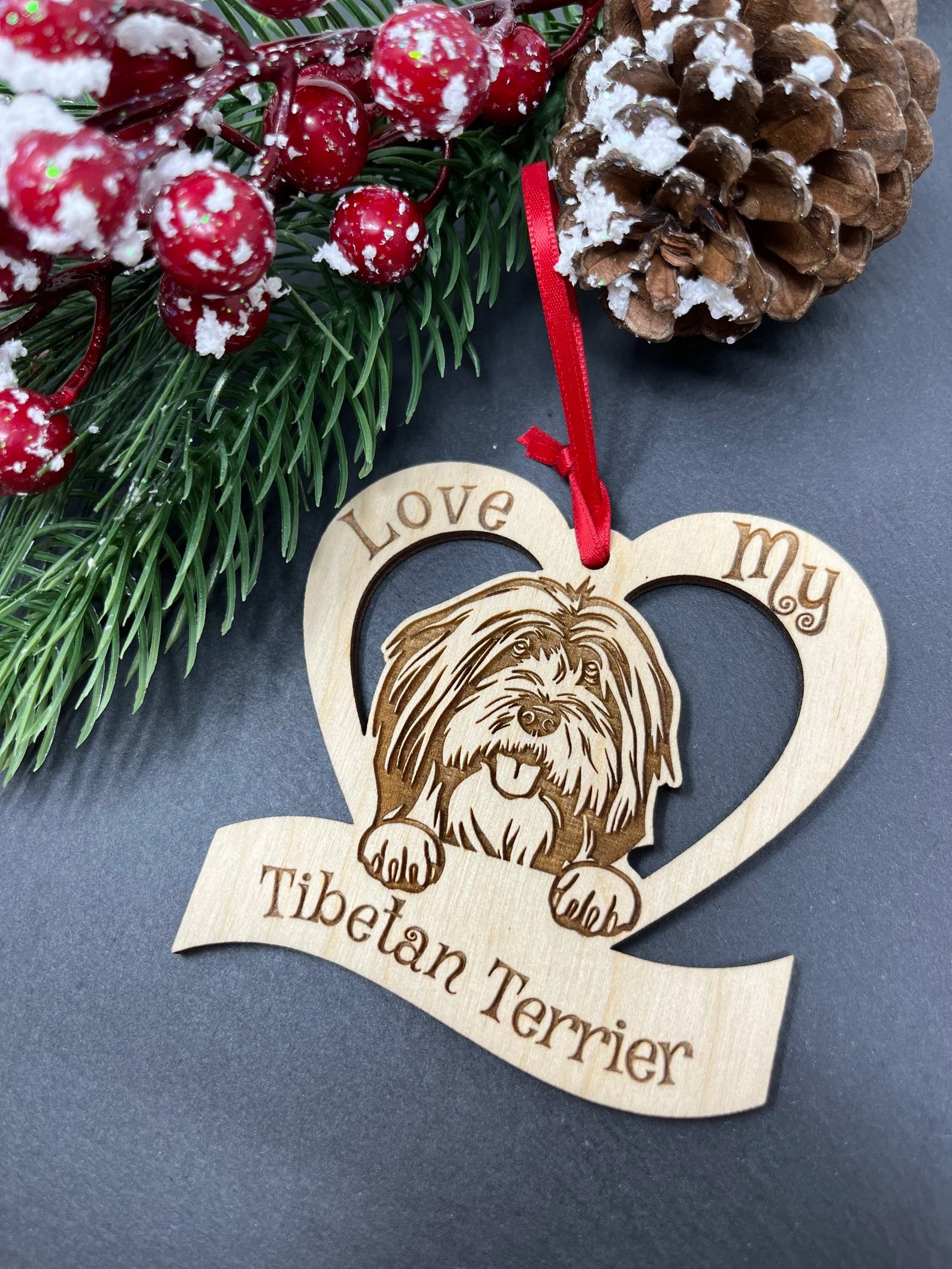 Love My Tibetan Terrier ornament made of laser engraved Baltic Birch wood, featuring a unique design and attached ribbon for hanging.