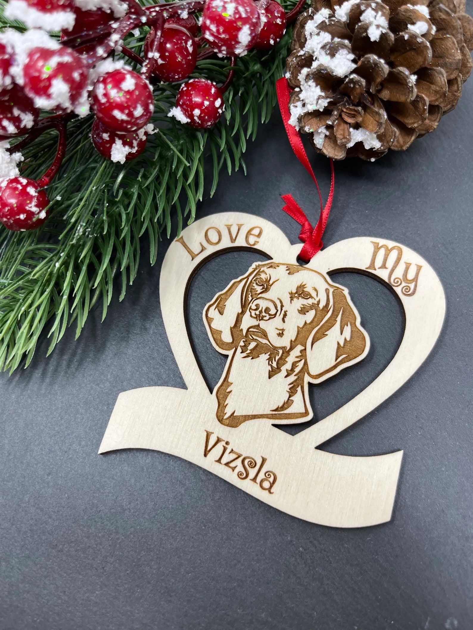 Love My Vizsla ornament made of laser engraved Baltic Birch wood, featuring a unique design and attached ribbon for hanging.