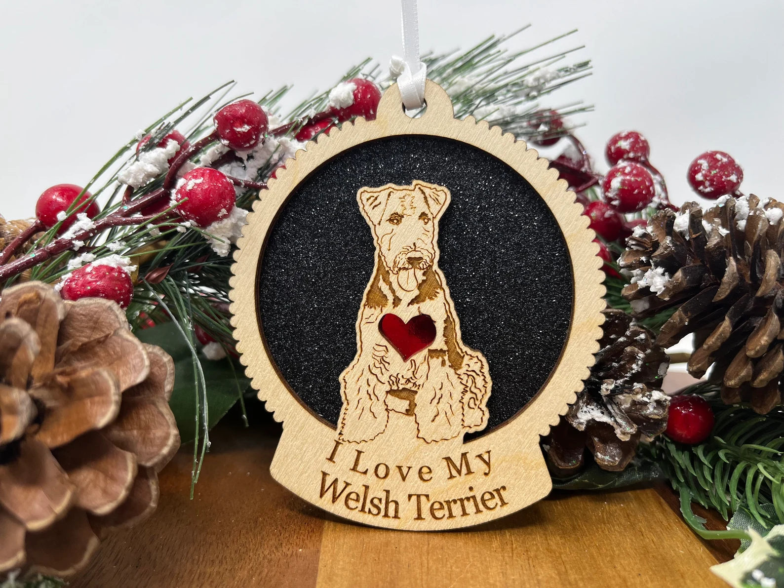 Laser cut wooden ornament featuring a Welsh Terrier silhouette, perfect for Christmas decoration.