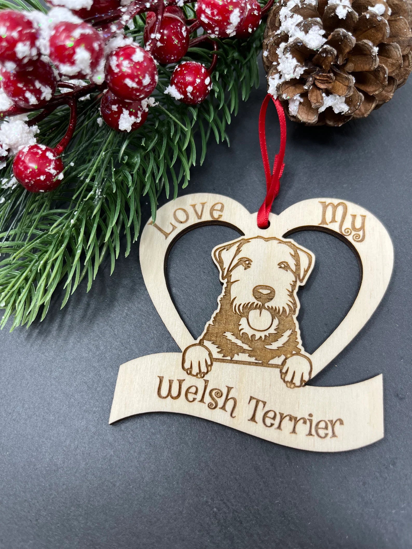 Beautiful laser engraved wooden ornament featuring a Welsh Terrier, perfect for Christmas decoration.