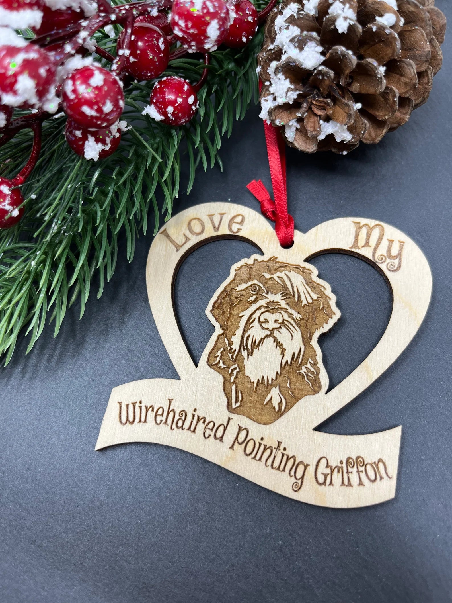 Laser engraved wooden ornament featuring a Wirehaired Pointing Griffon dog, perfect for Christmas decoration.