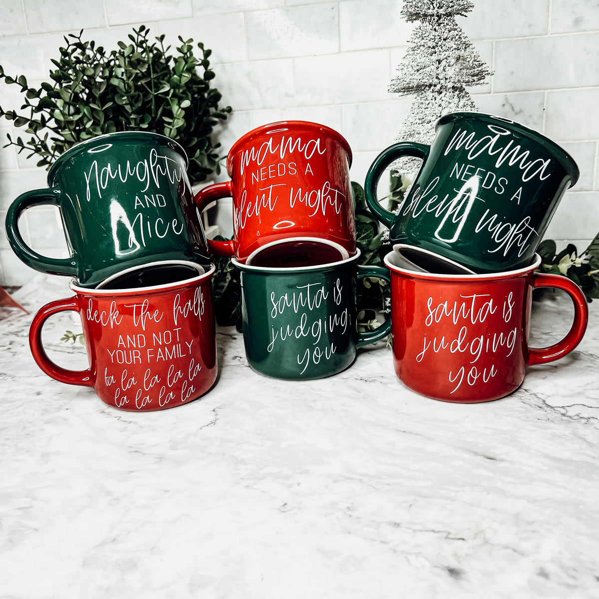 Mama Needs a Silent Mug in red and green ceramic with white lettering, showcasing a humorous design for parents.