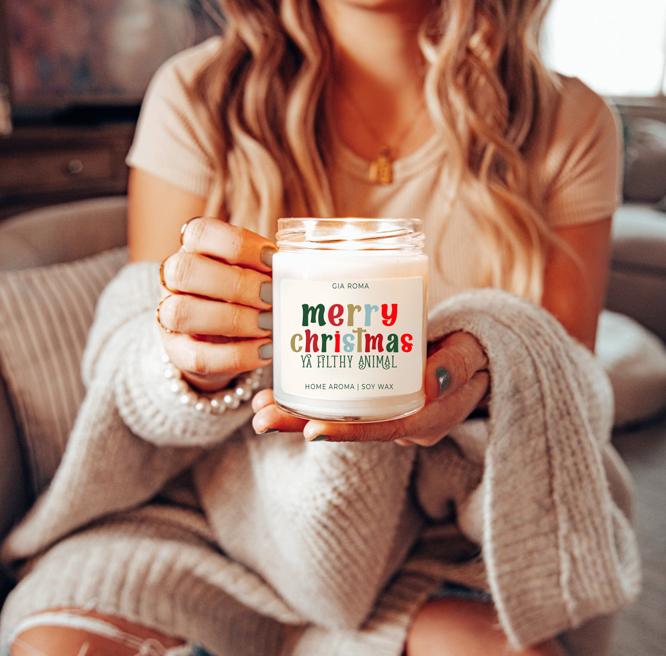 A beautifully designed Merry Christmas Candle in a 9oz jar, featuring a festive label and a warm glow, perfect for holiday decor.