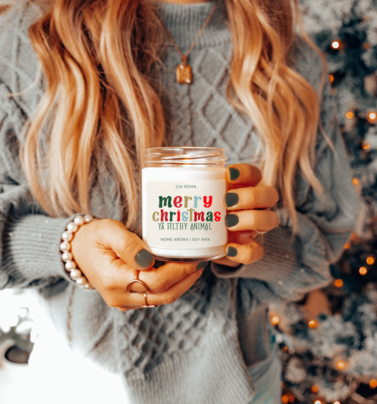 A beautifully designed Merry Christmas Candle in a 9oz jar, featuring a festive label and a warm glow, perfect for holiday decor.