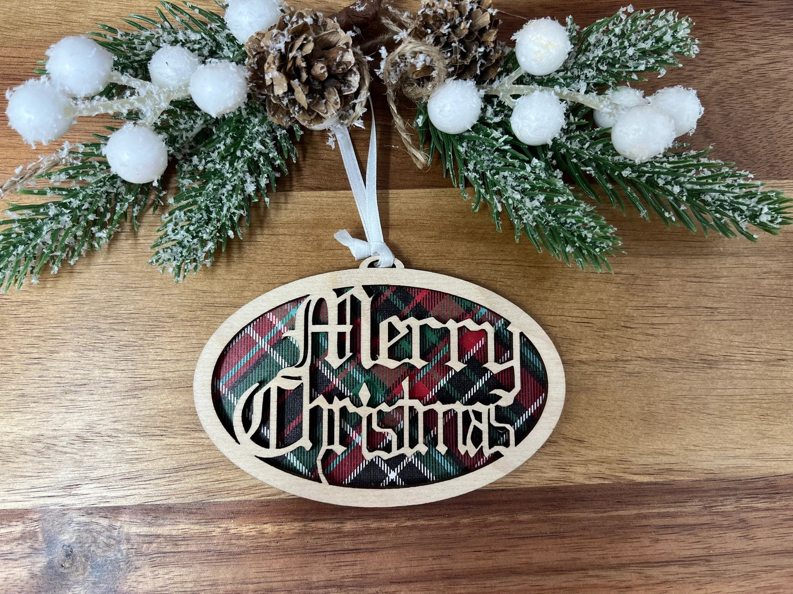 Merry Christmas Plaid Ornament made from premium Baltic Birch wood, featuring intricate laser-cut designs.