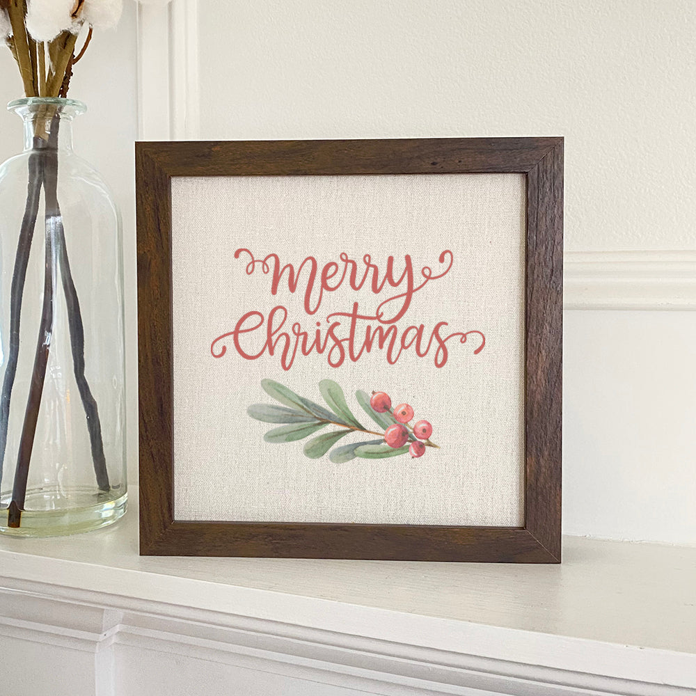 Merry Christmas Sprig framed sign with a stylized wood frame, featuring eco-friendly printing on a linen-look background.