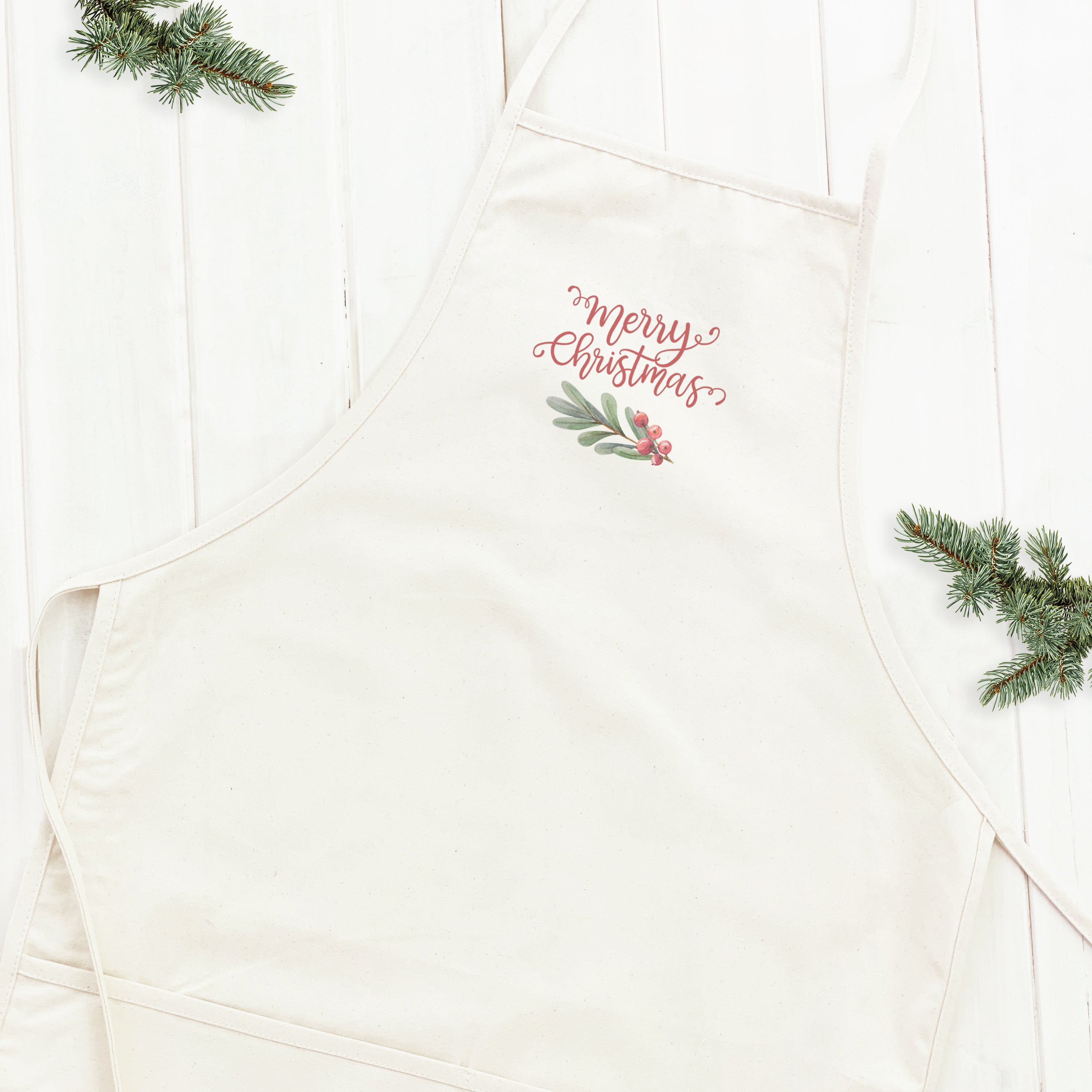 Merry Christmas Sprig Women's Apron featuring festive design and adjustable neck strap, made from durable cotton canvas.