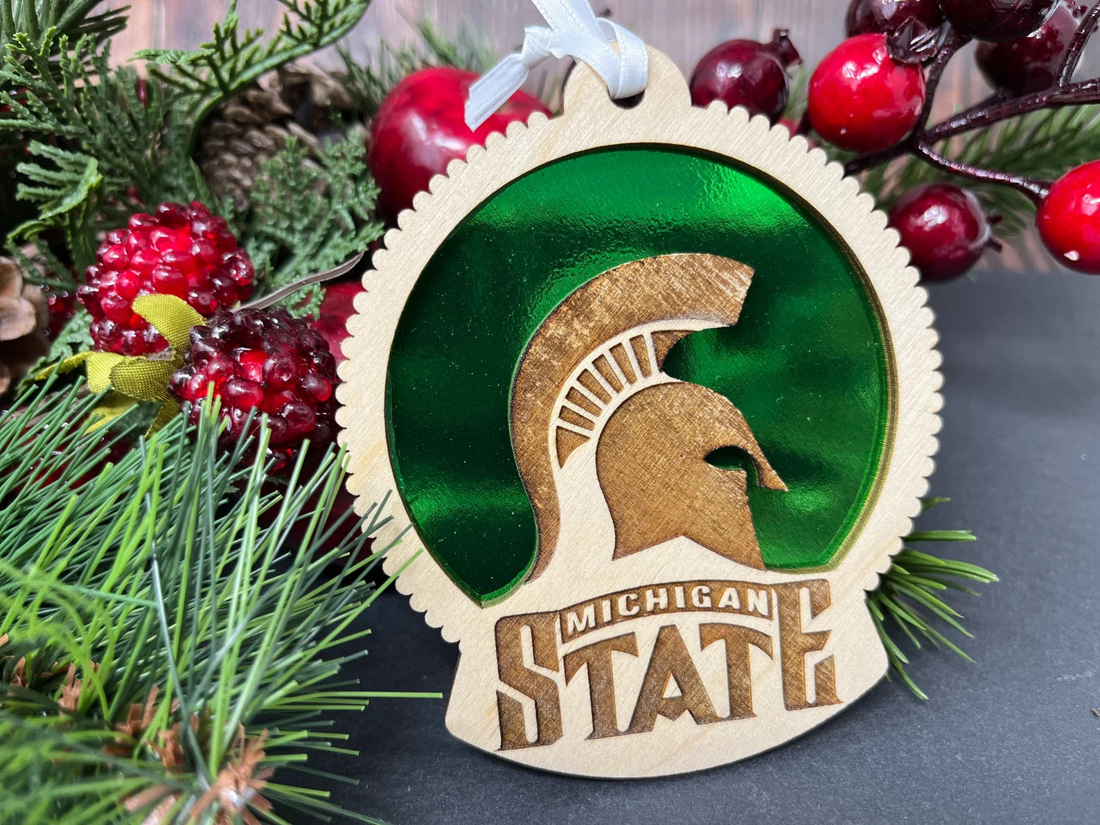 Handcrafted Michigan State University ornament made of birch wood, measuring 4 inches by 4 inches, beautifully packaged.