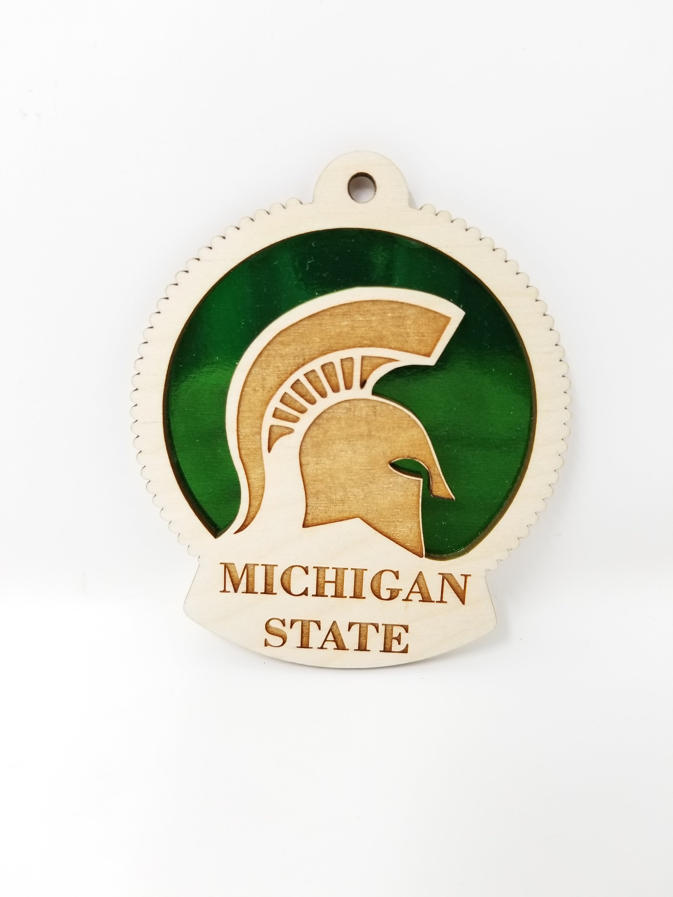 Handcrafted Michigan State University ornament made of birch wood, measuring 4 inches by 4 inches, beautifully packaged.