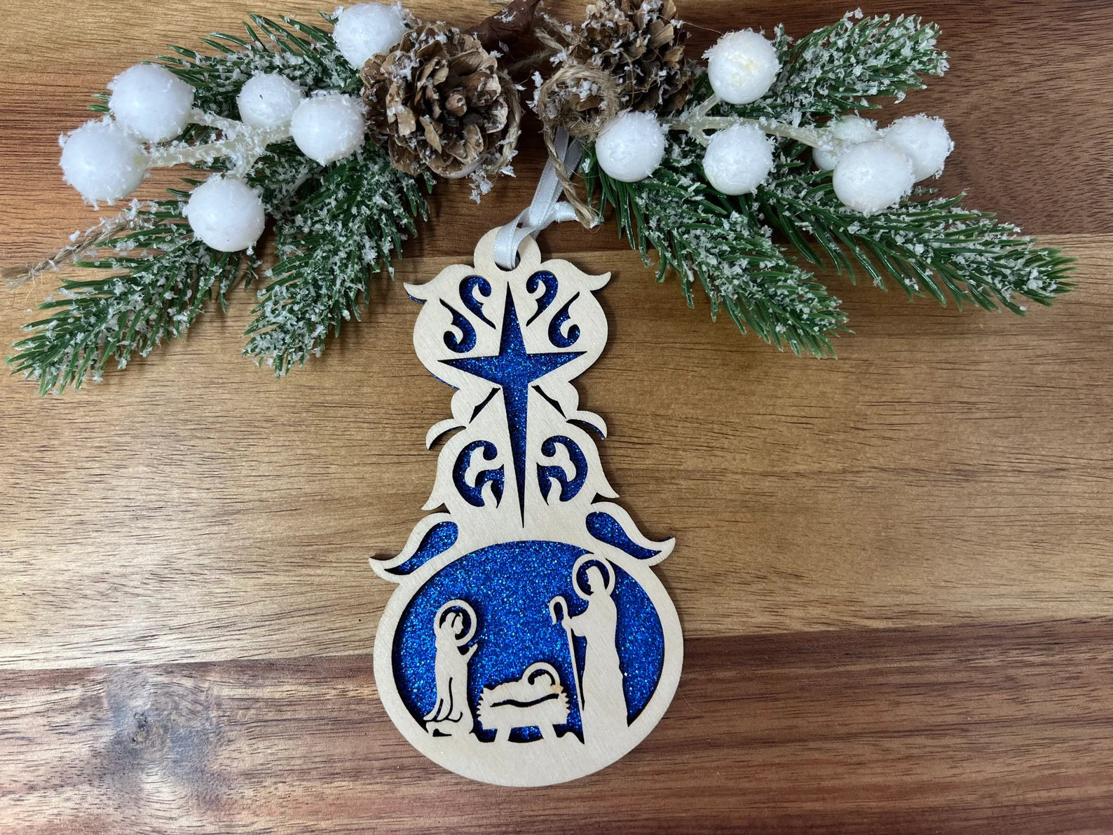 Nativity Drop ornament made of premium Baltic Birch wood, featuring intricate laser-cut designs of the nativity scene.