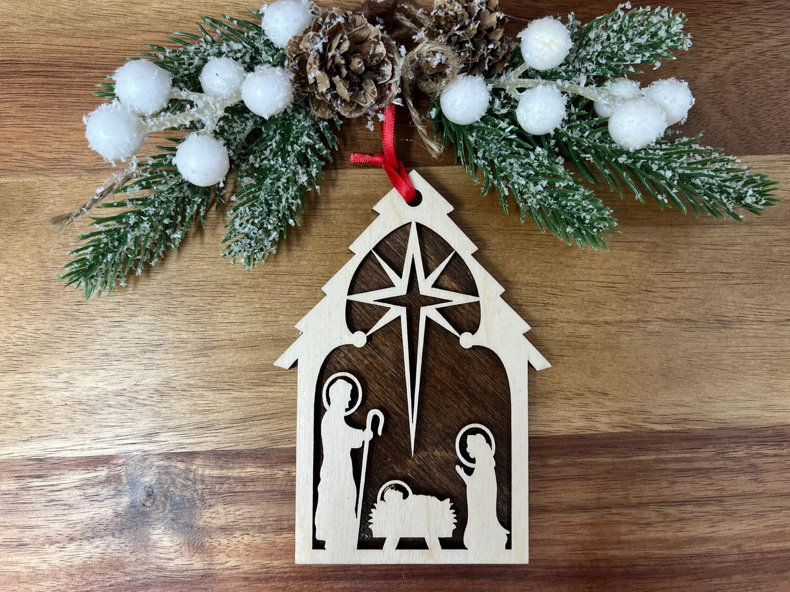 Nativity ornament made of premium Baltic Birch wood, featuring intricate laser-cut details and a wood backing, elegantly packaged in a cotton-filled jewelry box.